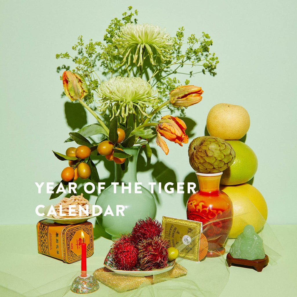 Year of the Tiger Image featuring fruits, flowers, Budai, and other symbolic objects