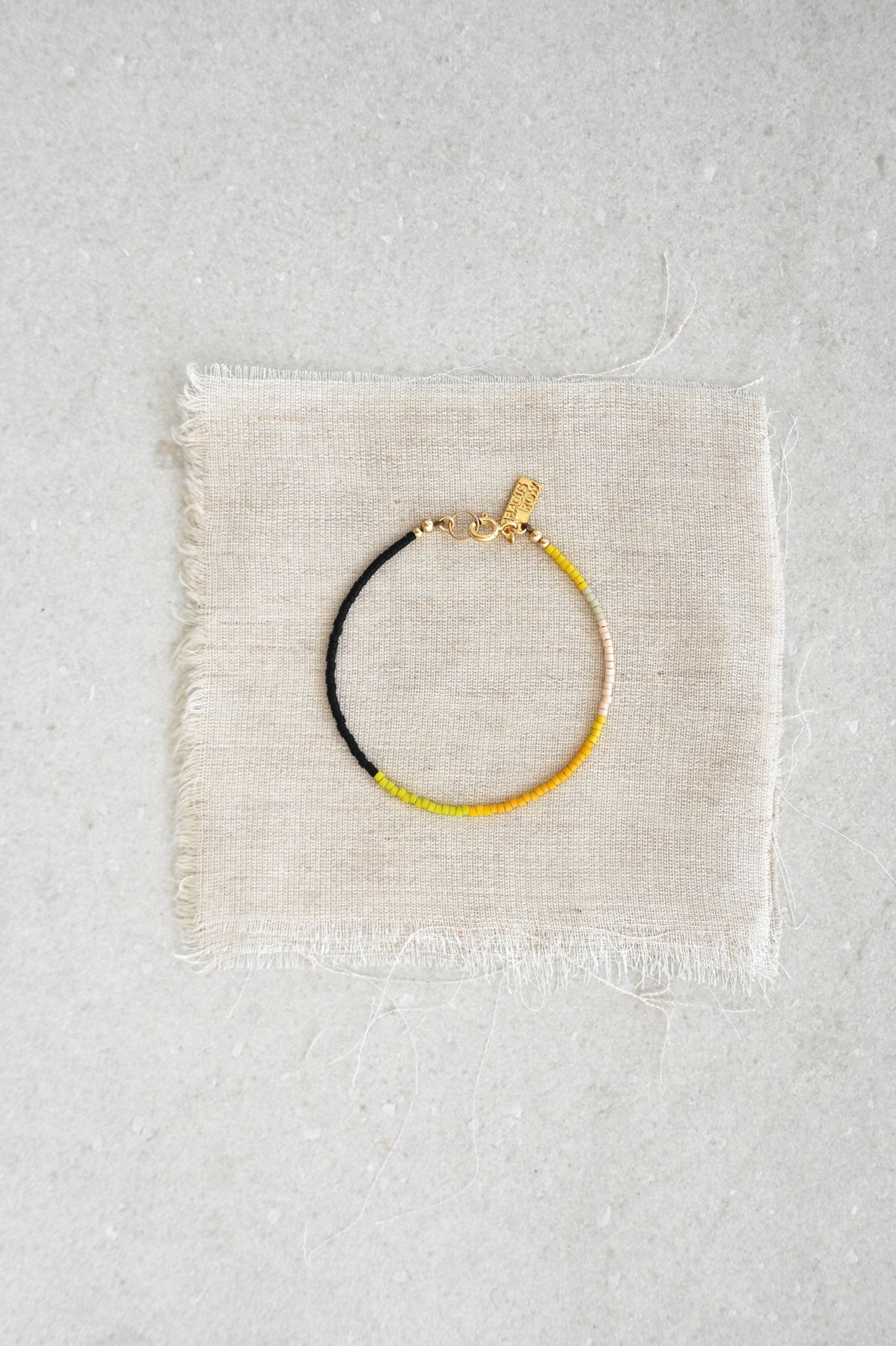A Yellow Sun Bracelet styled at Abacus Row Handmade Jewelry