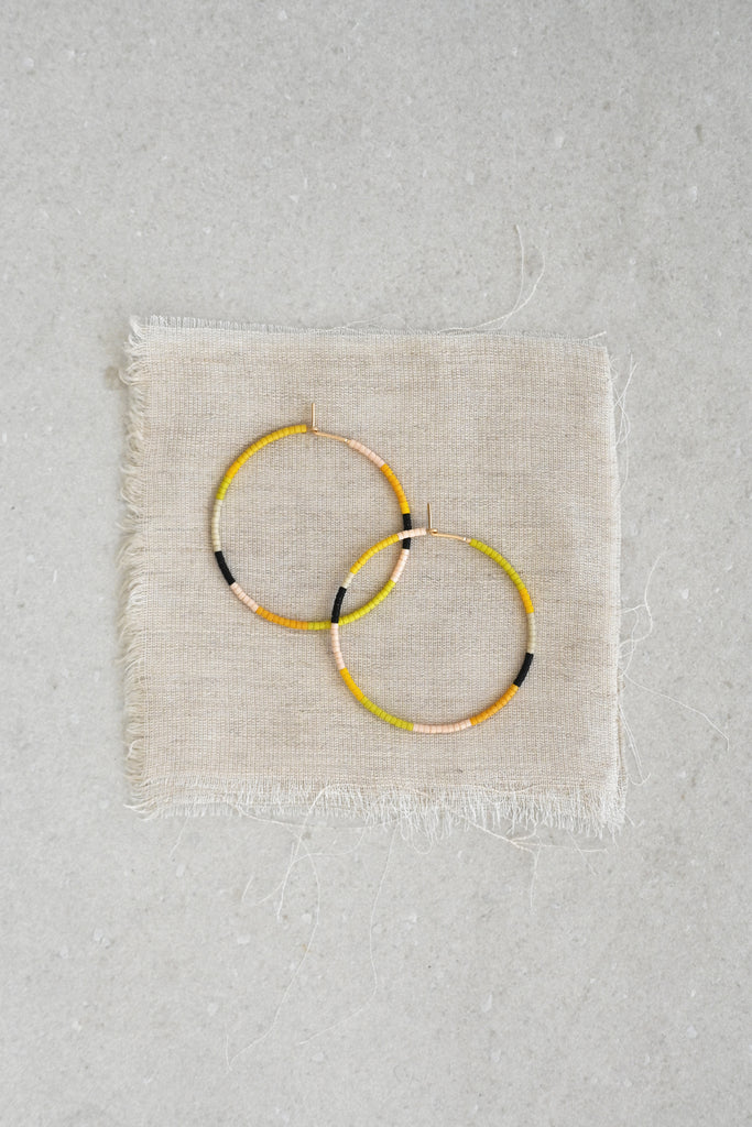 A Yellow Sun Large Hoop Earrings styled at Abacus Row Handmade Jewelry