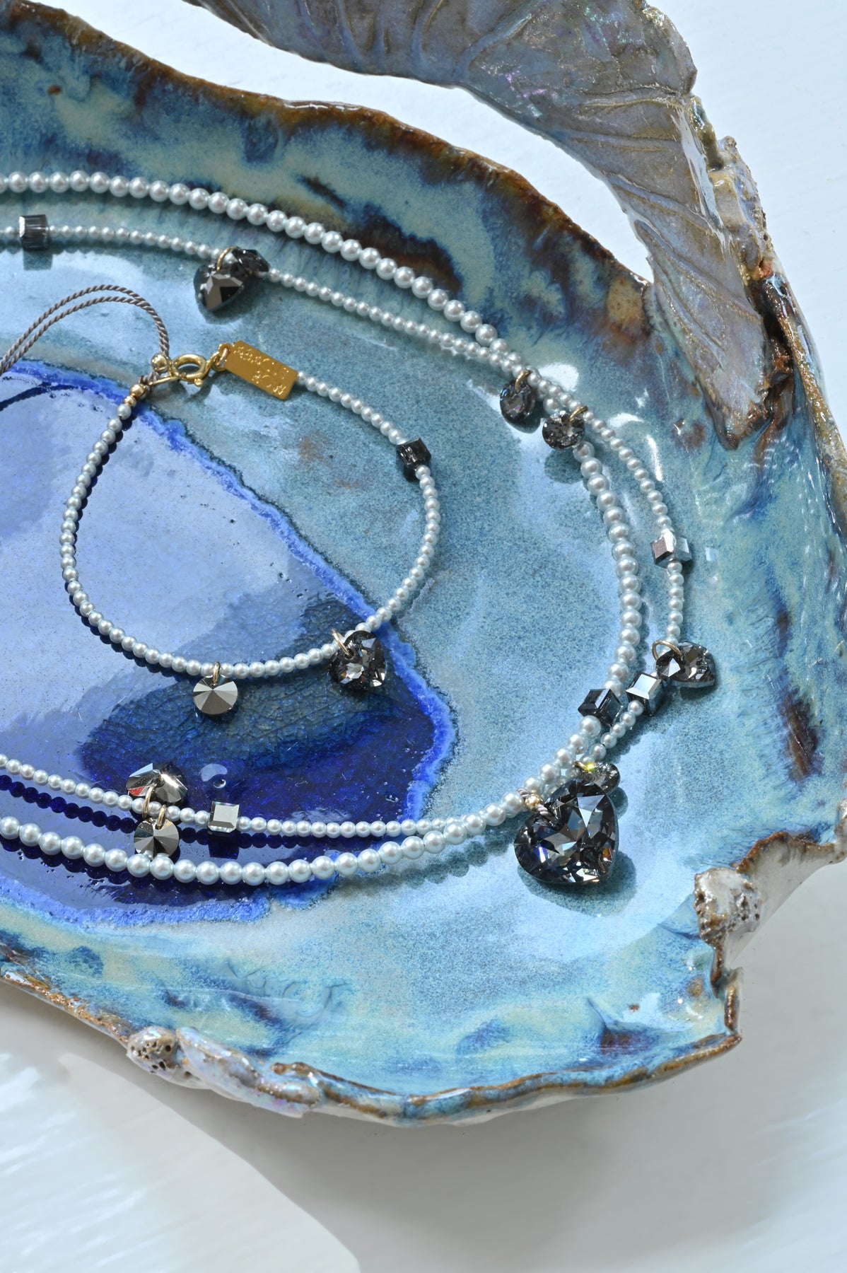 Styled Detail of the Moonstruck Big Heart Necklaces and Bracelet at Abacus Row Handmade Jewelry