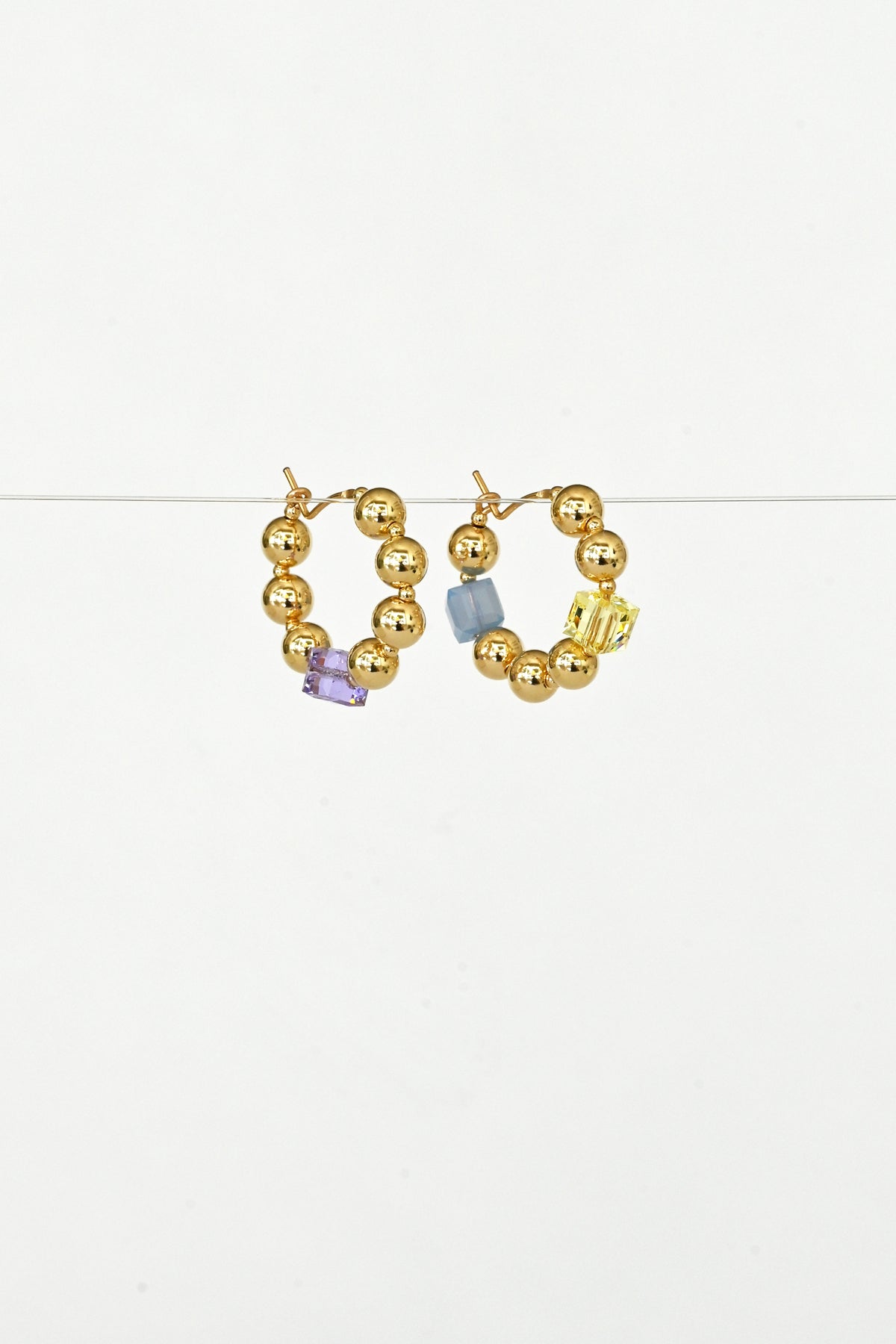 Angled View of the Small Daisy Chain Earrings No.2 by Abacus Row Handmade Jewelry