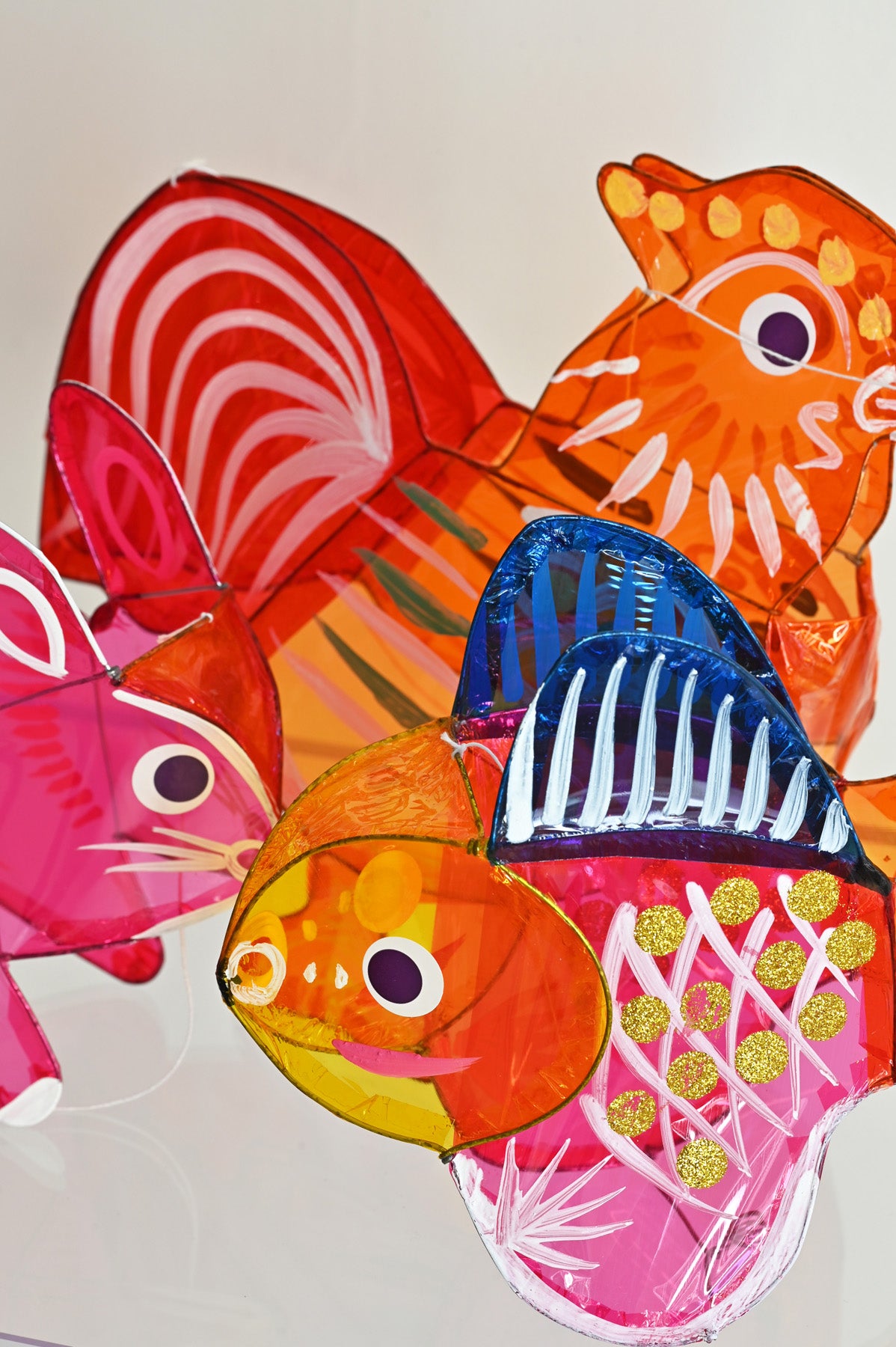 Close up of Small Rooster and Bunny and Fish Lantern at Abacus Row Handmade Jewelry