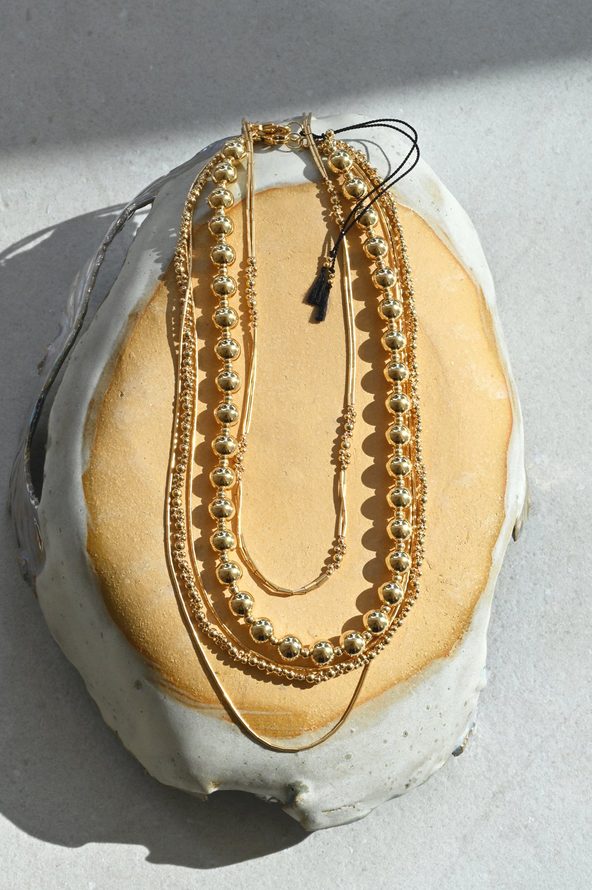 Moon Sun Necklace with Black Tassels with Subra and Zeta Necklaces by Abacus Row Jewelry