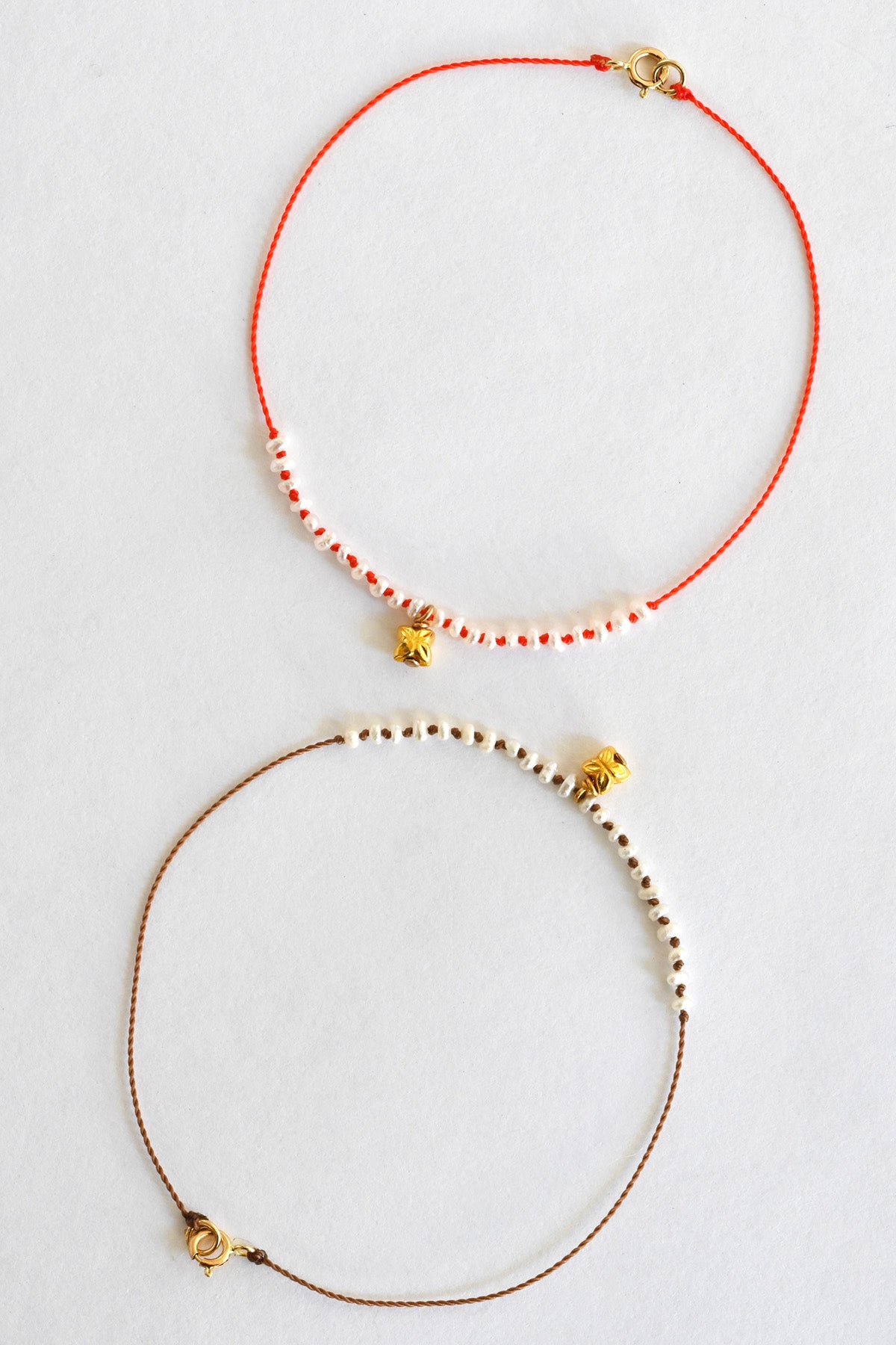 Natural and Coral Blossom Charm Bracelets by See Real Flowers at Abacus Row