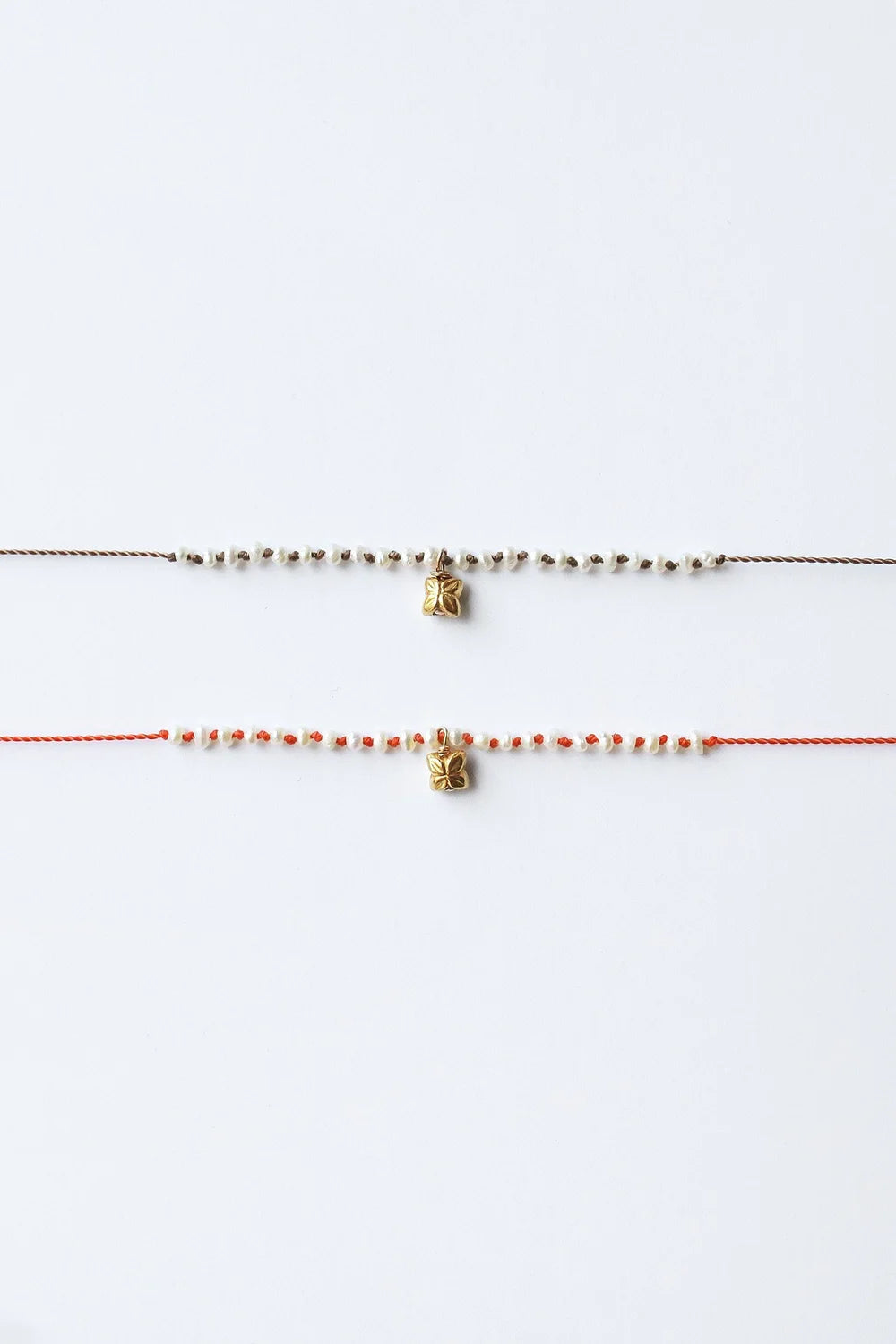 Details of Natural and Coral Blossom Charm Bracelets by See Real Flowers at Abacus Row