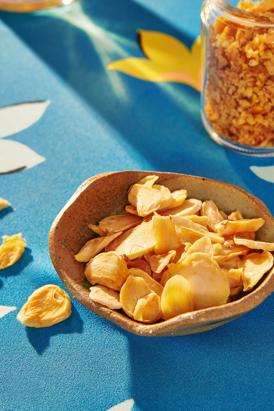 In a bowl Sliced Northern Mountain Garlic by Vân Vân at Abacus Row Jewelry