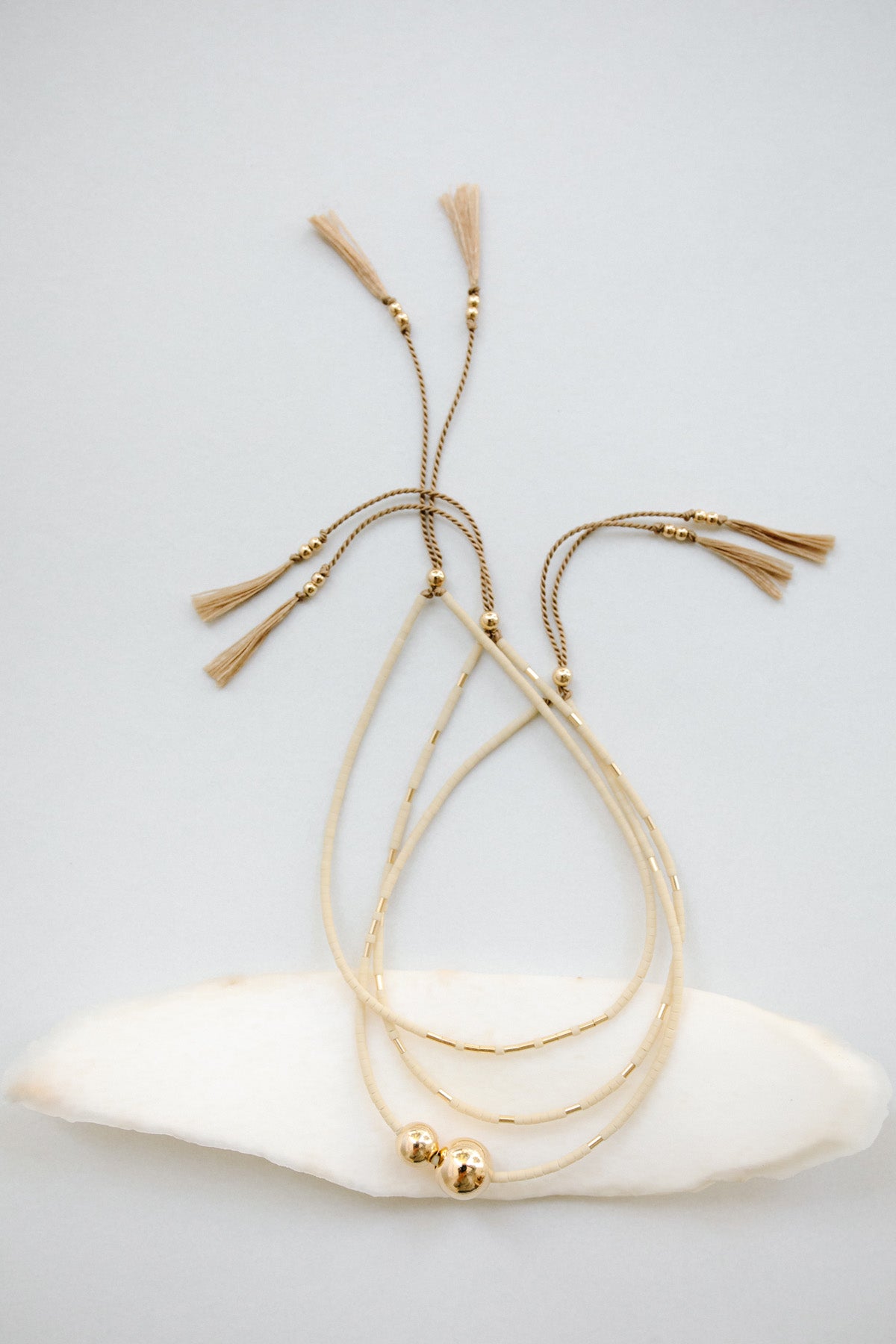 Bracelets in Oyster by Abacus Row Handmade Jewelry