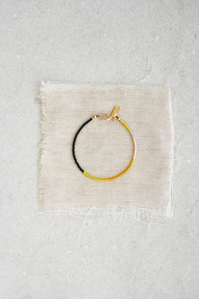 A Yellow Sun Bracelet styled at Abacus Row Handmade Jewelry