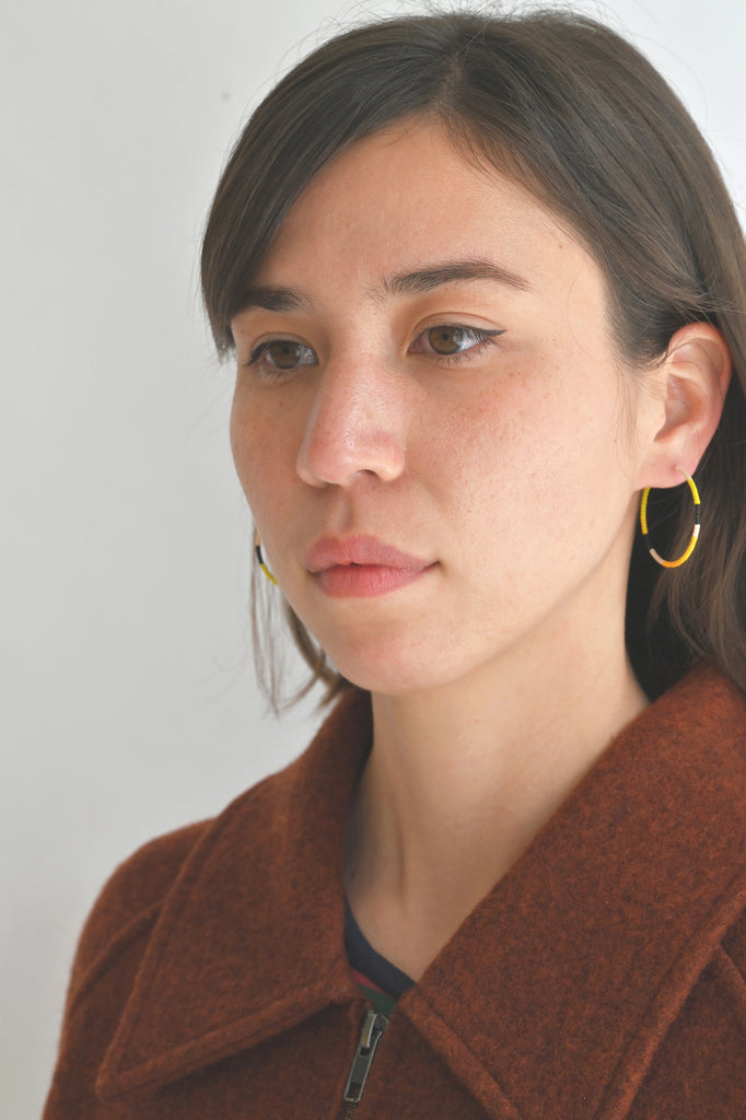 A Yellow Sun Hoop Earrings styled on model at Abacus Row Handmade Jewelry