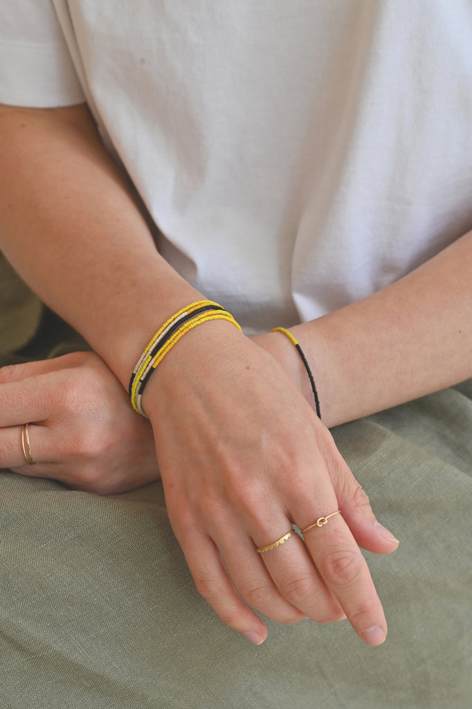 A Yellow Sun Wrap styled on model at Abacus Row Handmade Jewelry