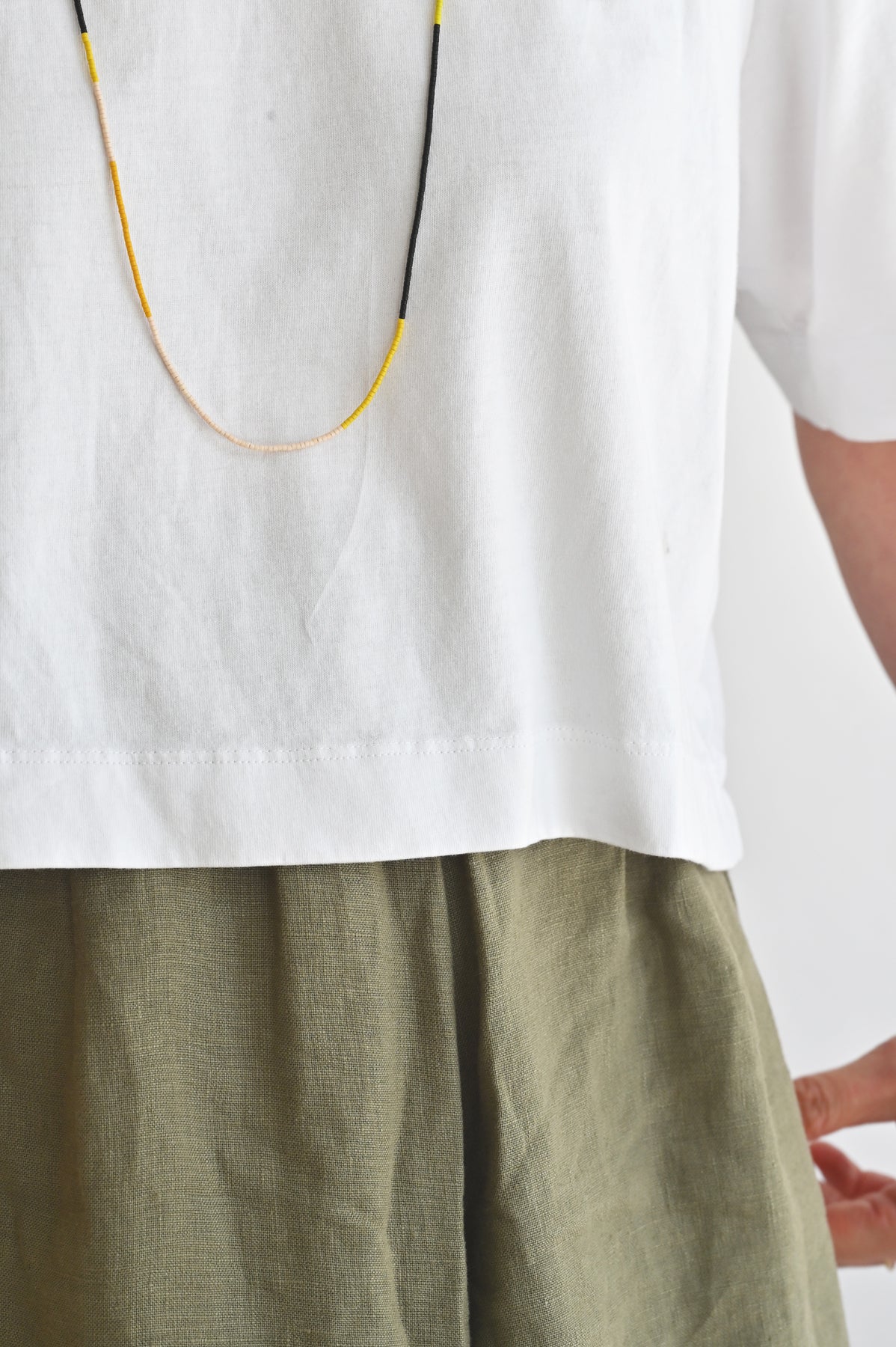 A Yellow Sun wrap as necklace styled at Abacus Row Handmade Jewelry