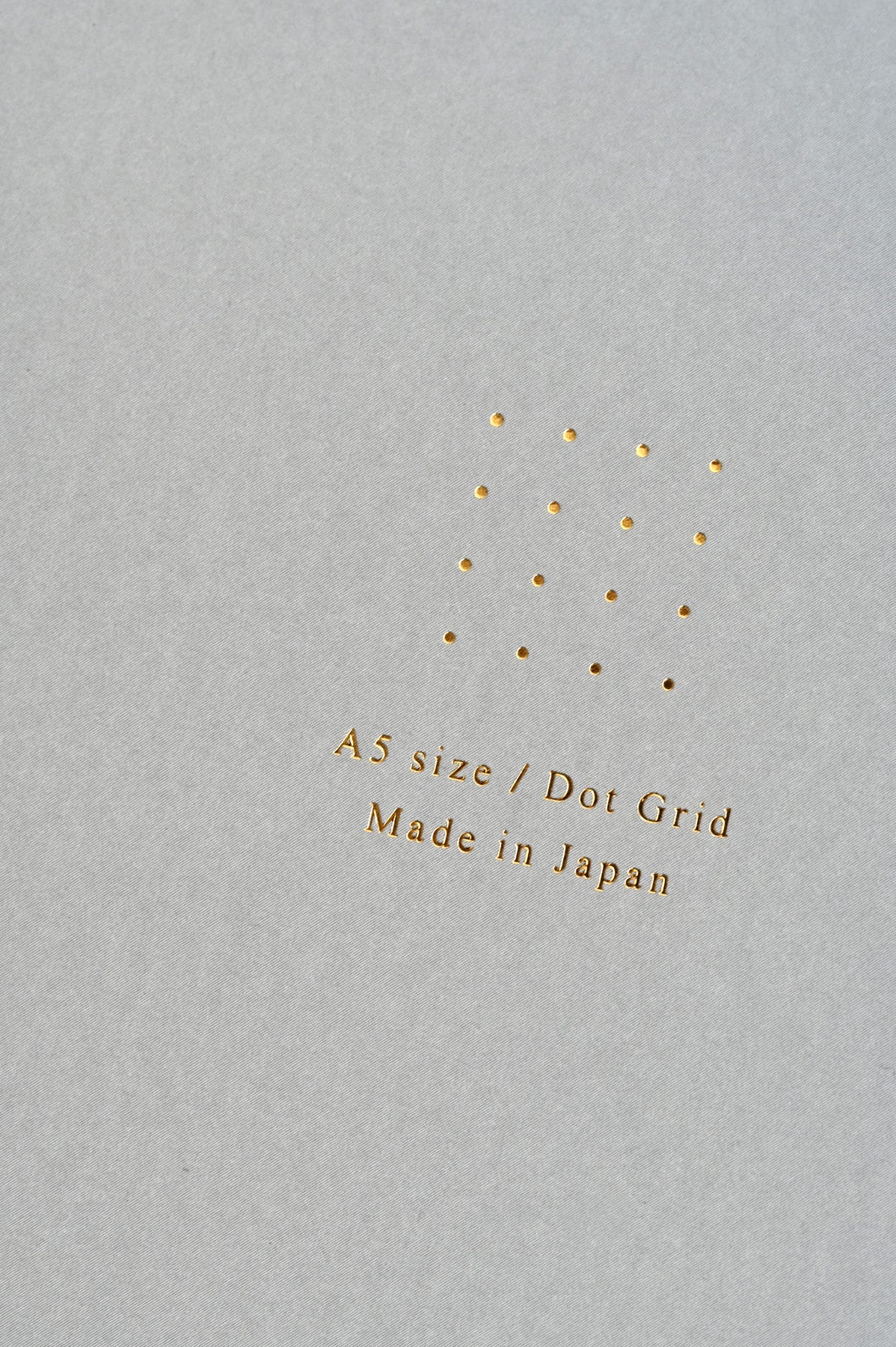 Gray Midori Dot Grid A5 Notebook gold detail at Abacus Row