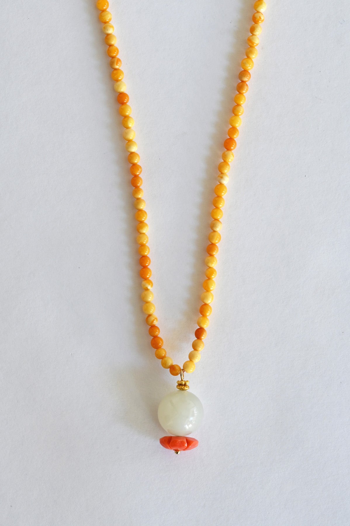 Mai Beaded Amber Necklace with Jade Coral Pendant at Abacus Row Jewelry