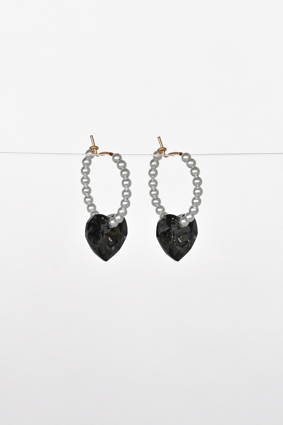 Moonstruck Big Heart Earrings angled view at Abacus Row Handmade Jewelry