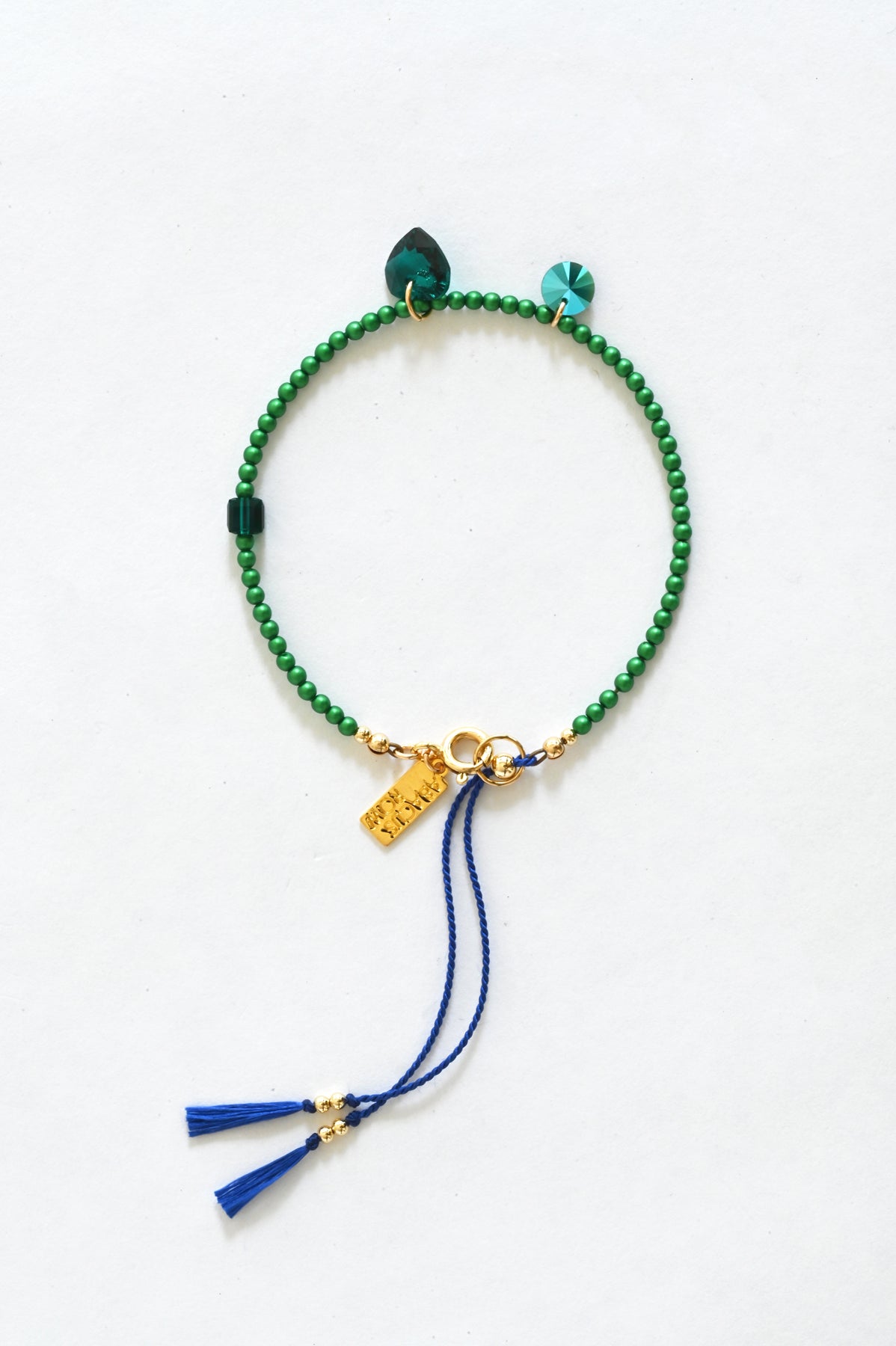 Emerald Big Heart Bracelet with sapphire silk cord at Abacus Row Handmade Jewelry