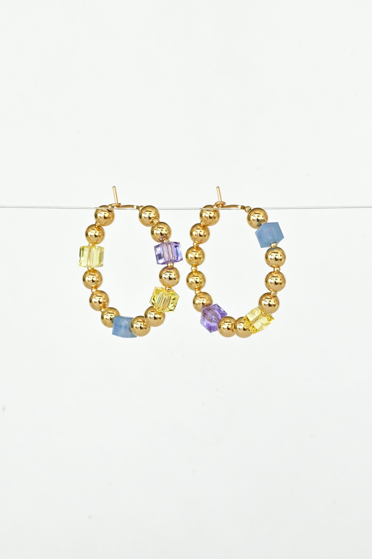 Angled View of the Large Daisy Chain Earrings No.2 by Abacus Row Handmade Jewelry