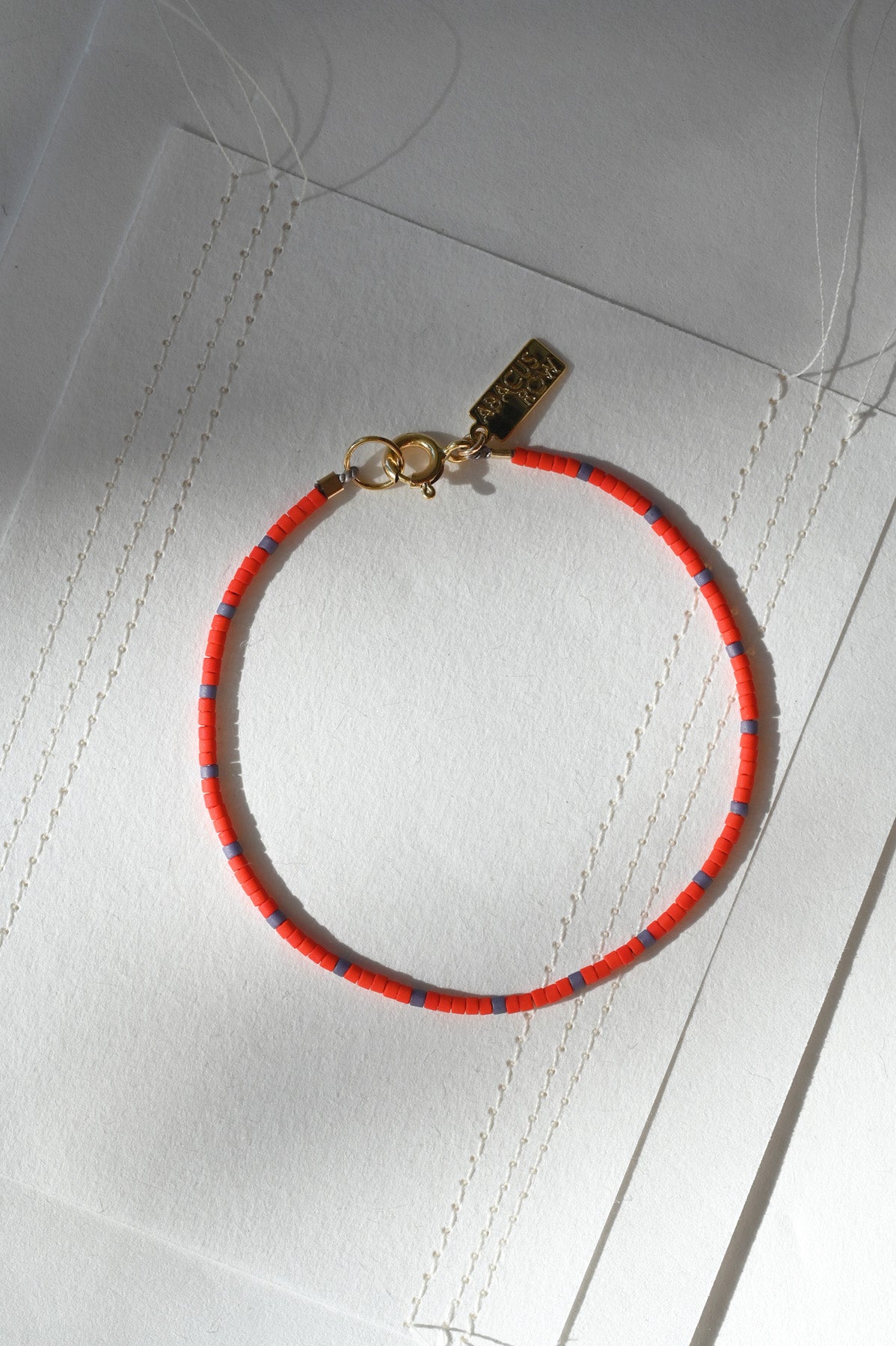 Dipsea Bracelet in Red and Plum at Abacus Row Handmade Jewelry