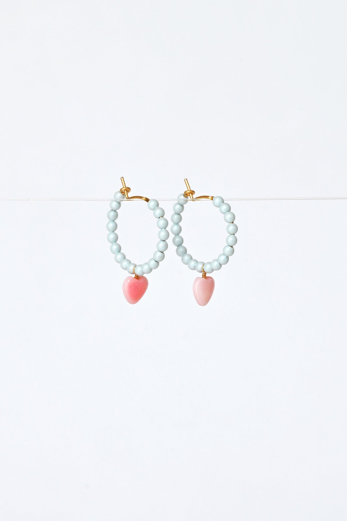 Side View of the Dream Cloud Blue Wishing Heart Earrings by Abacus Row Handmade Jewelry