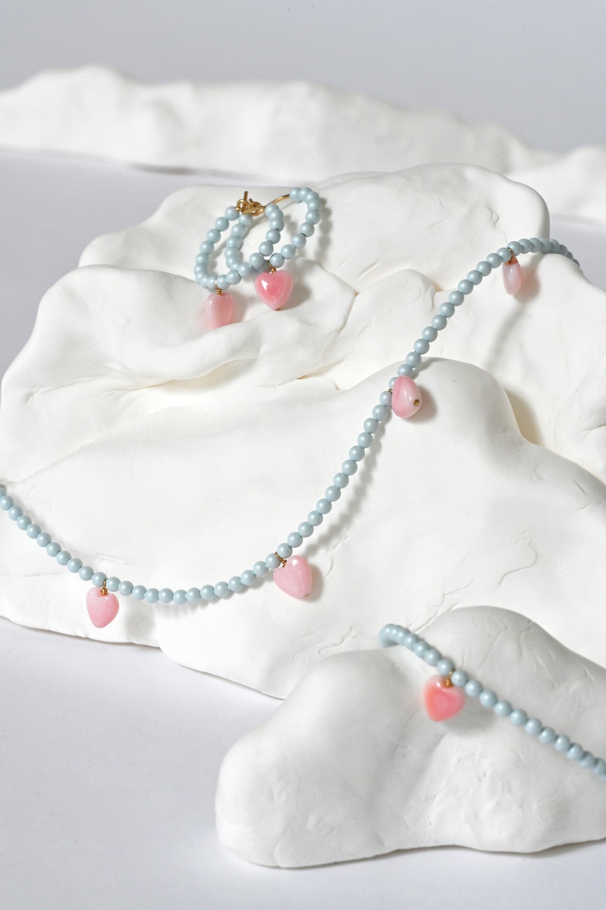 Styled Blue and Pink Dream Cloud Pieces by Abacus Row Handmade Jewelry