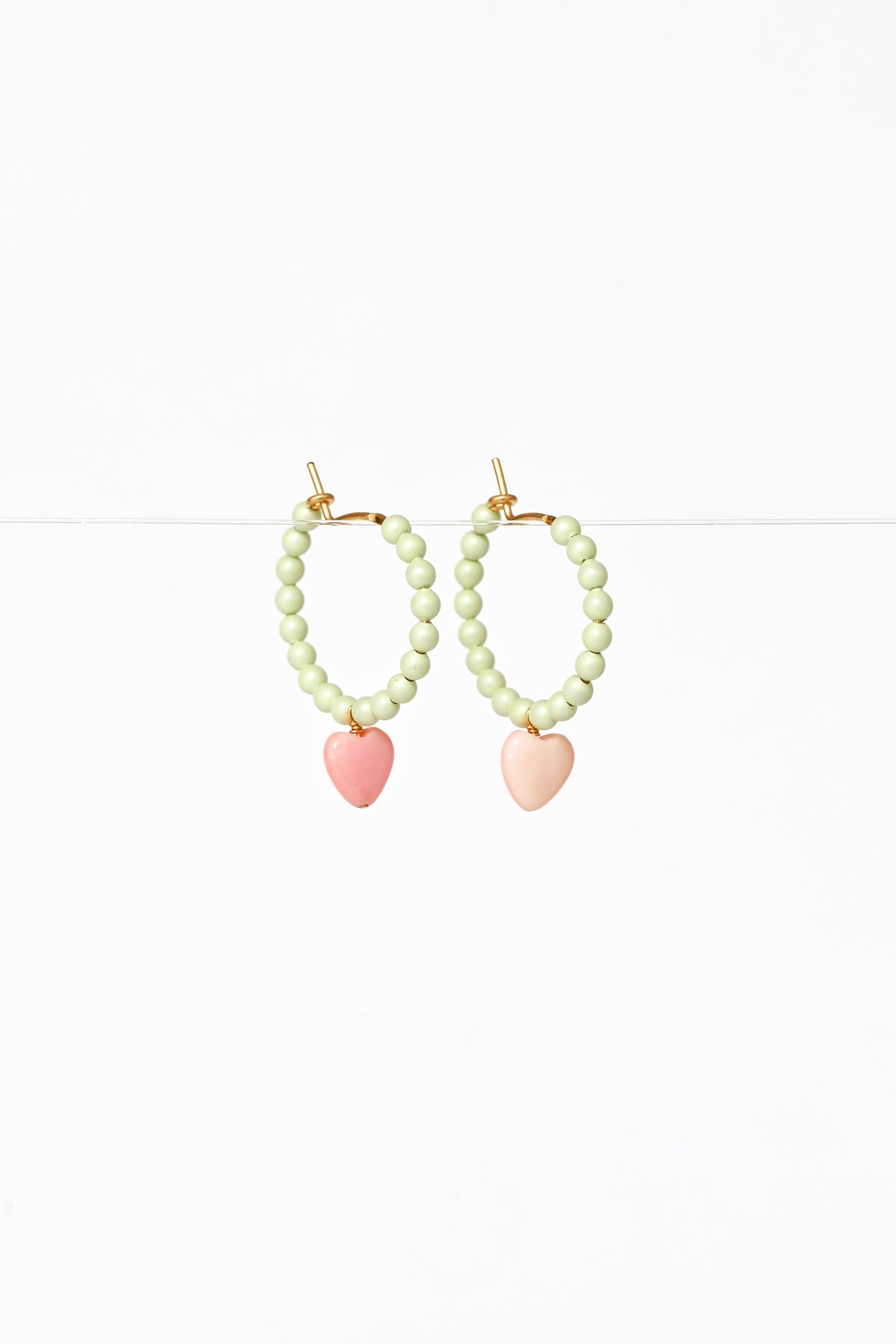 Side View of the Dream Cloud Green Wishing Heart Earrings by Abacus Row Handmade Jewelry