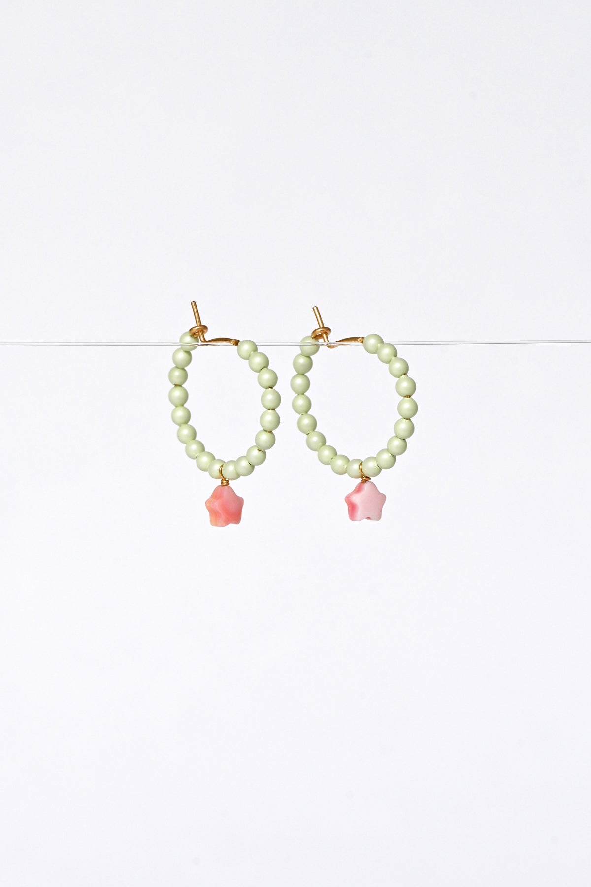 Side View of Dream Cloud Green Wishing Star Earrings by Abacus Row Handmade Jewelry