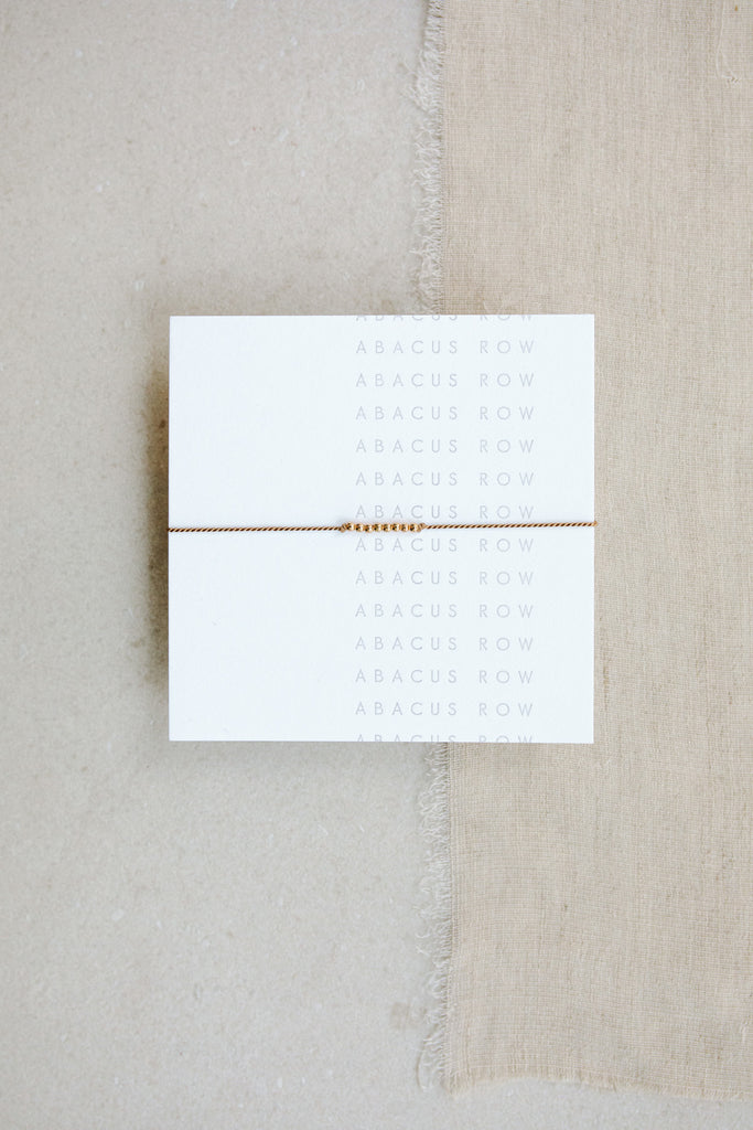 Friendship Bracelet No.3 in beige Fawn on card by Abacus Row Handmade Jewelry