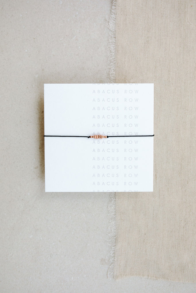 Friendship Bracelet No.5 in Black on card by Abacus Row Handmade Jewelry