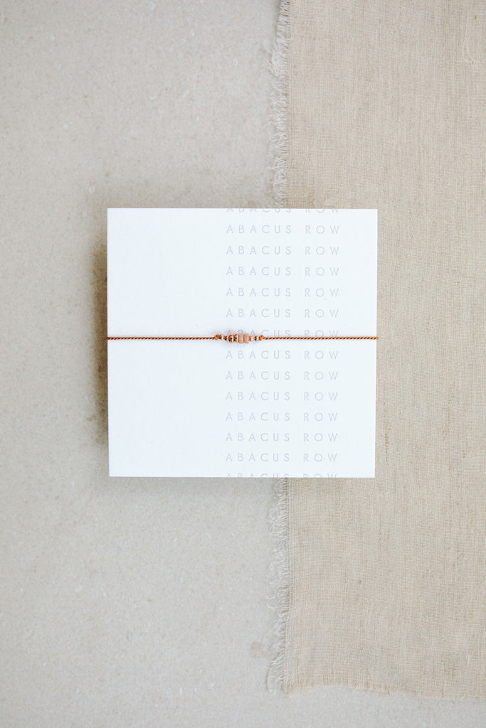 Friendship Bracelet No.5 in Clay on card by Abacus Row Handmade Jewelry