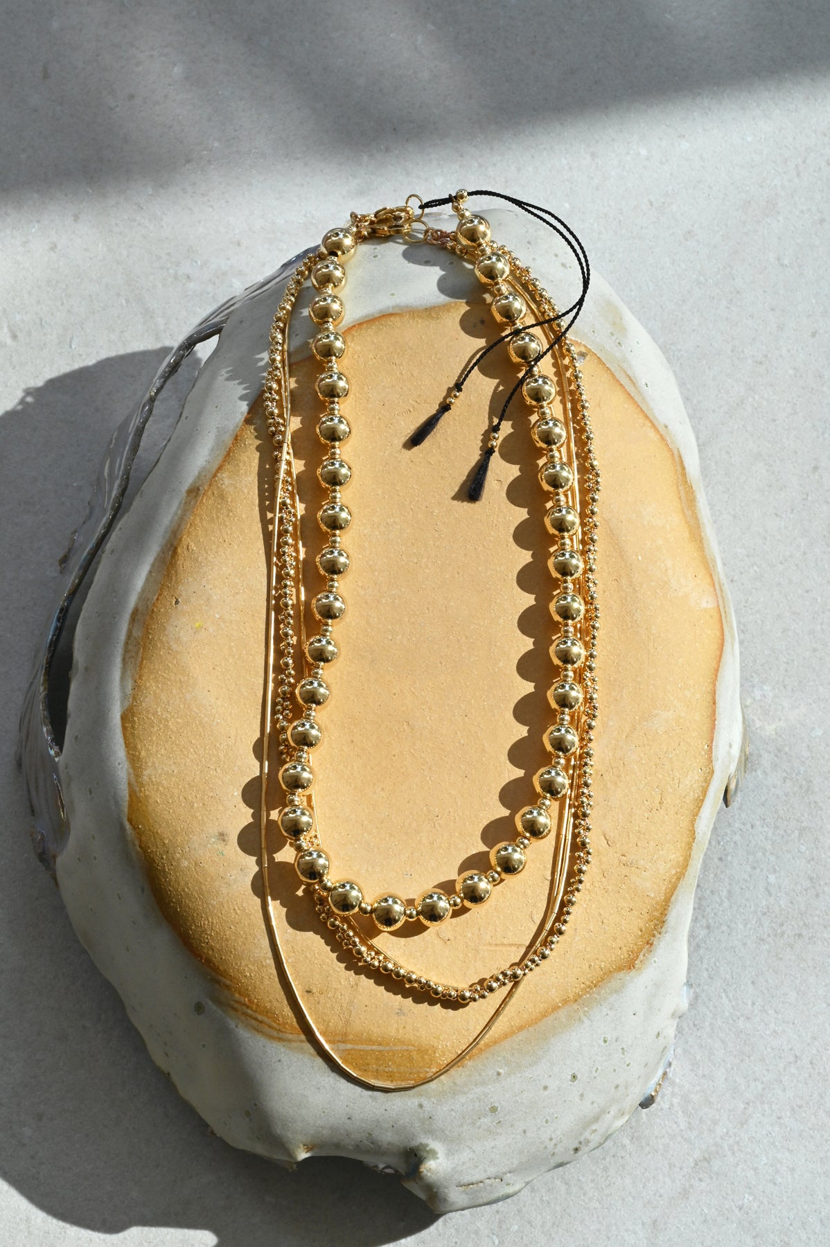 Zeta Necklace Styled with Moon Sun Necklace at Abacus Row Handmade Jewelry