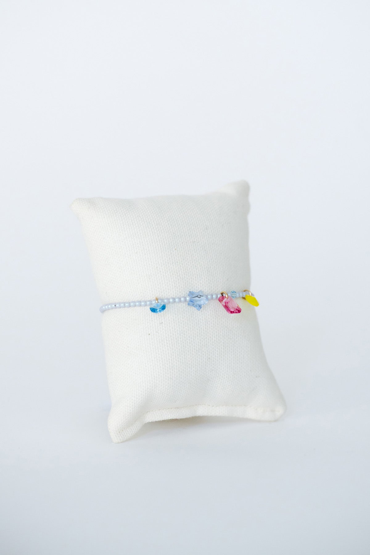 Stardust Bracelet No.3 on pillow at Abacus Row Handmade Jewelry