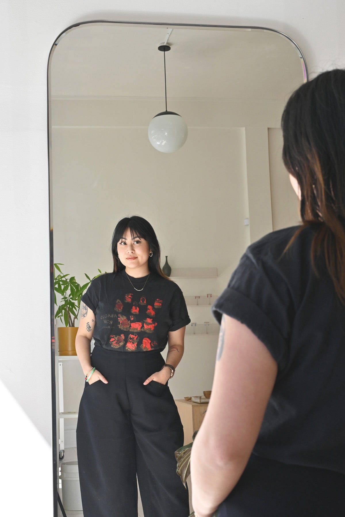 Tiff in a Three Harmony Animals Tee Shirt at Abacus Row Handmade Jewelry