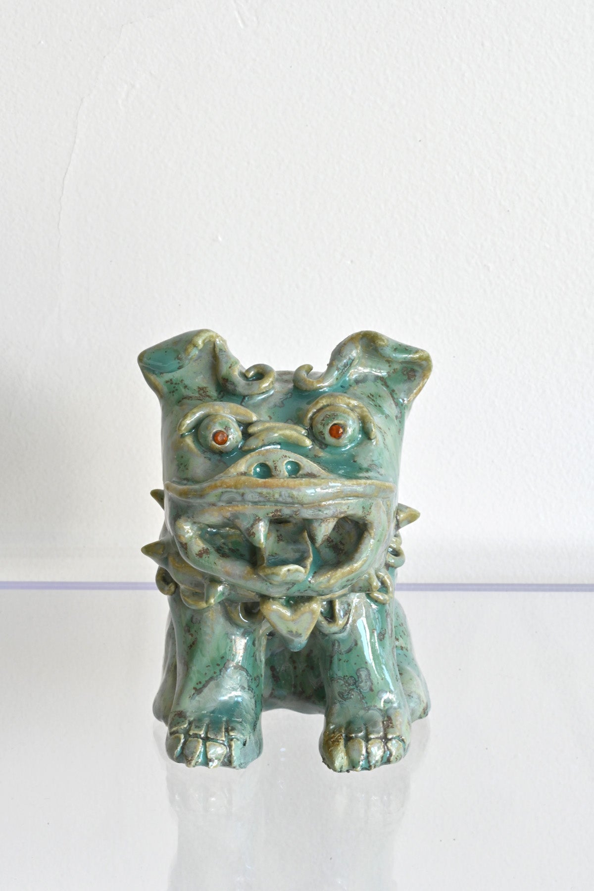Front of Red Garnet Eyed Mini Fu Dog by Ahn Lee at Abacus Row Handmade Jewelry