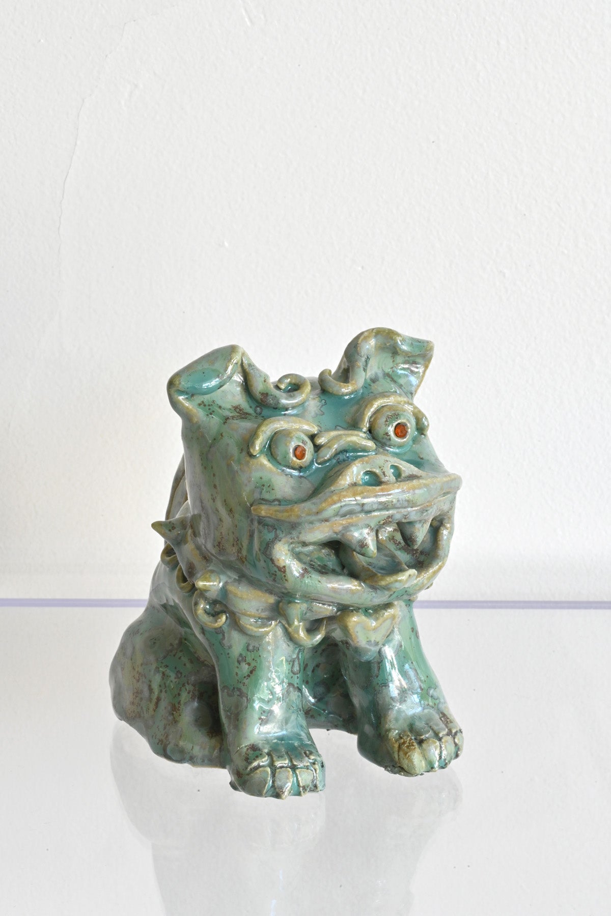 Right of Red Garnet Eyed Mini Fu Dog by Ahn Lee at Abacus Row Handmade Jewelry