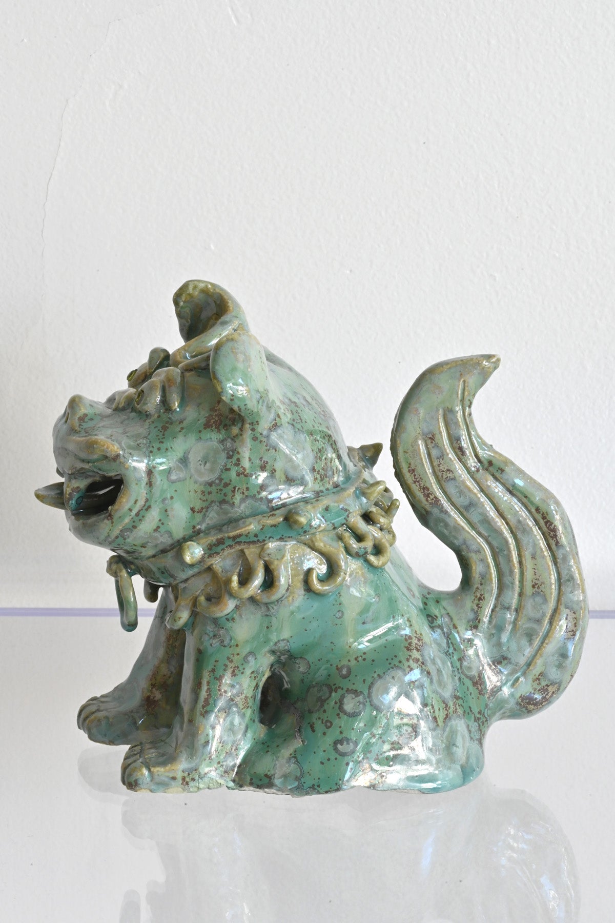 Left Side of Peridot Eyed Mini Fu Dog by Ahn Lee at Abacus Row Handmade Jewelry