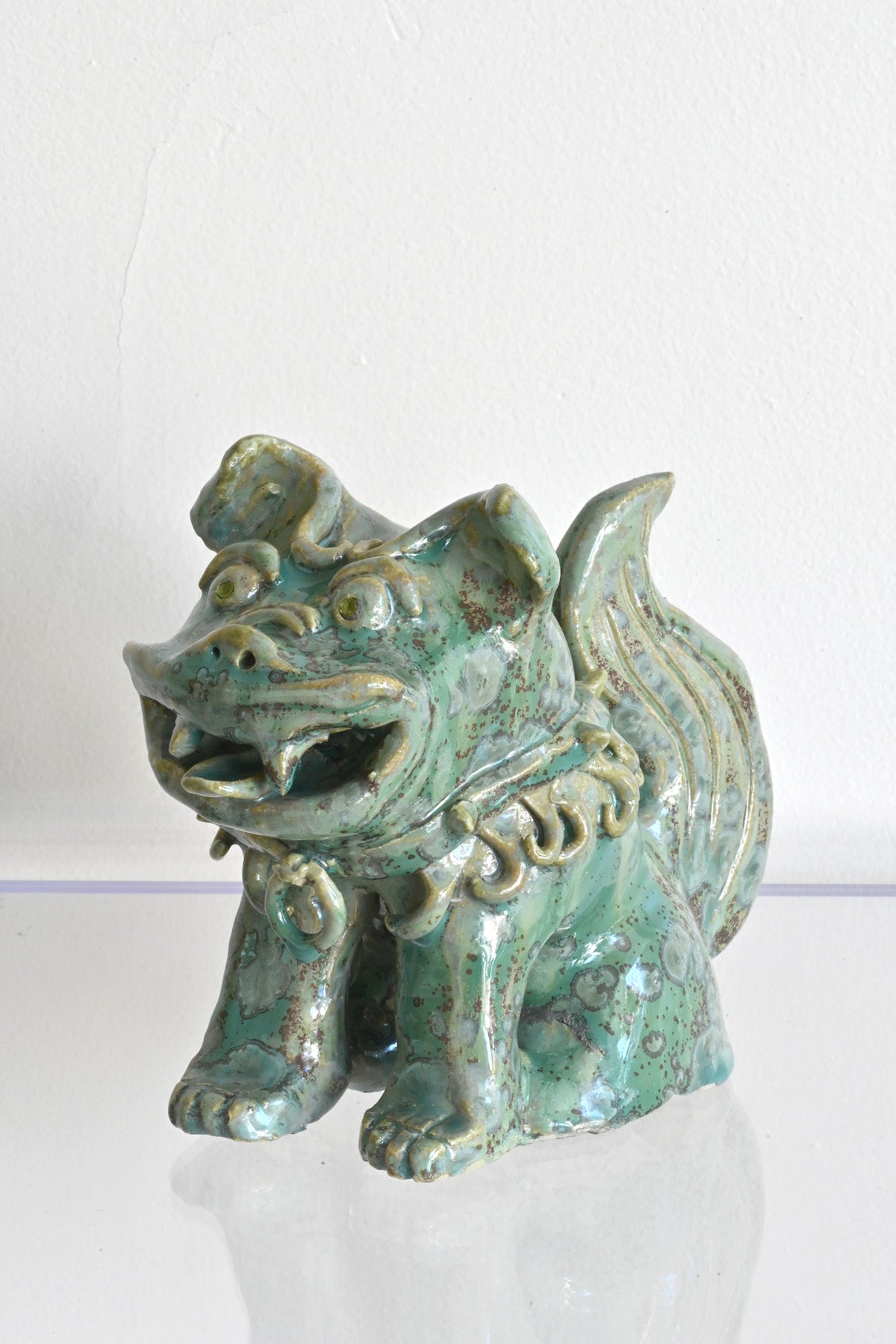 Front Left Side of Peridot Eyed Mini Fu Dog by Ahn Lee at Abacus Row Handmade Jewelry