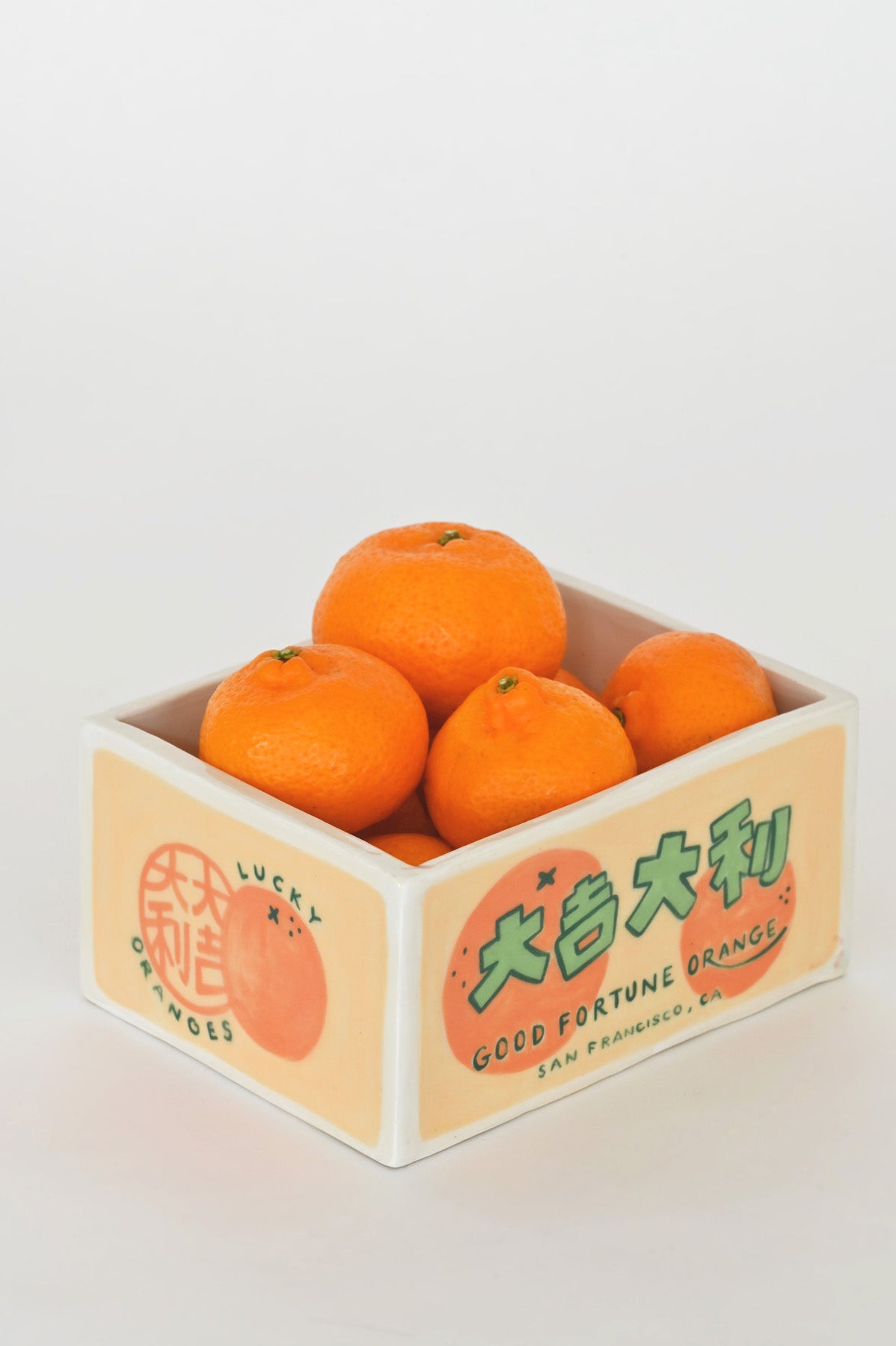 Mandarin filled Good Fortune Orange Trinket Box by Caf Caf Ceramique at Abacus Row