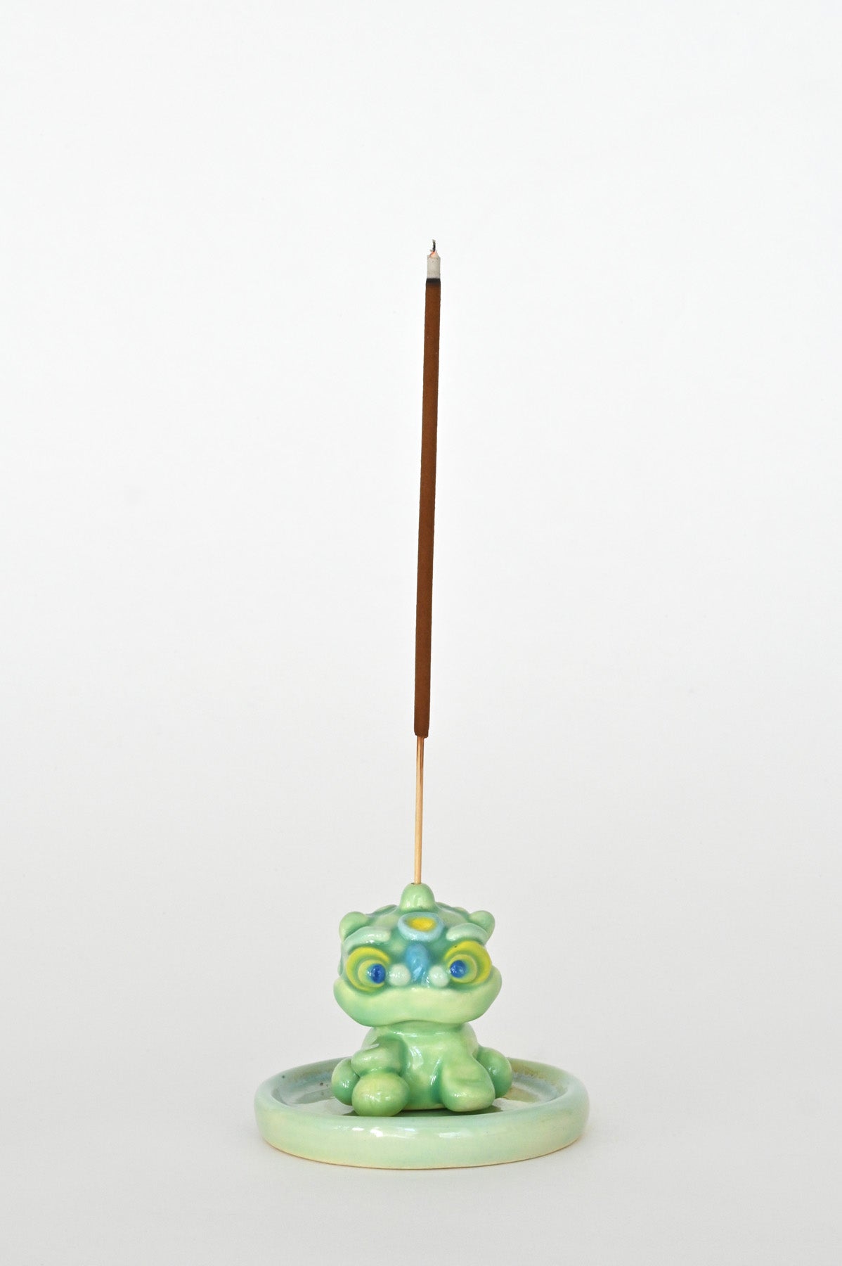 Male Lucky Lion holder with incense by Caf Caf Ceramique at Abacus Row
