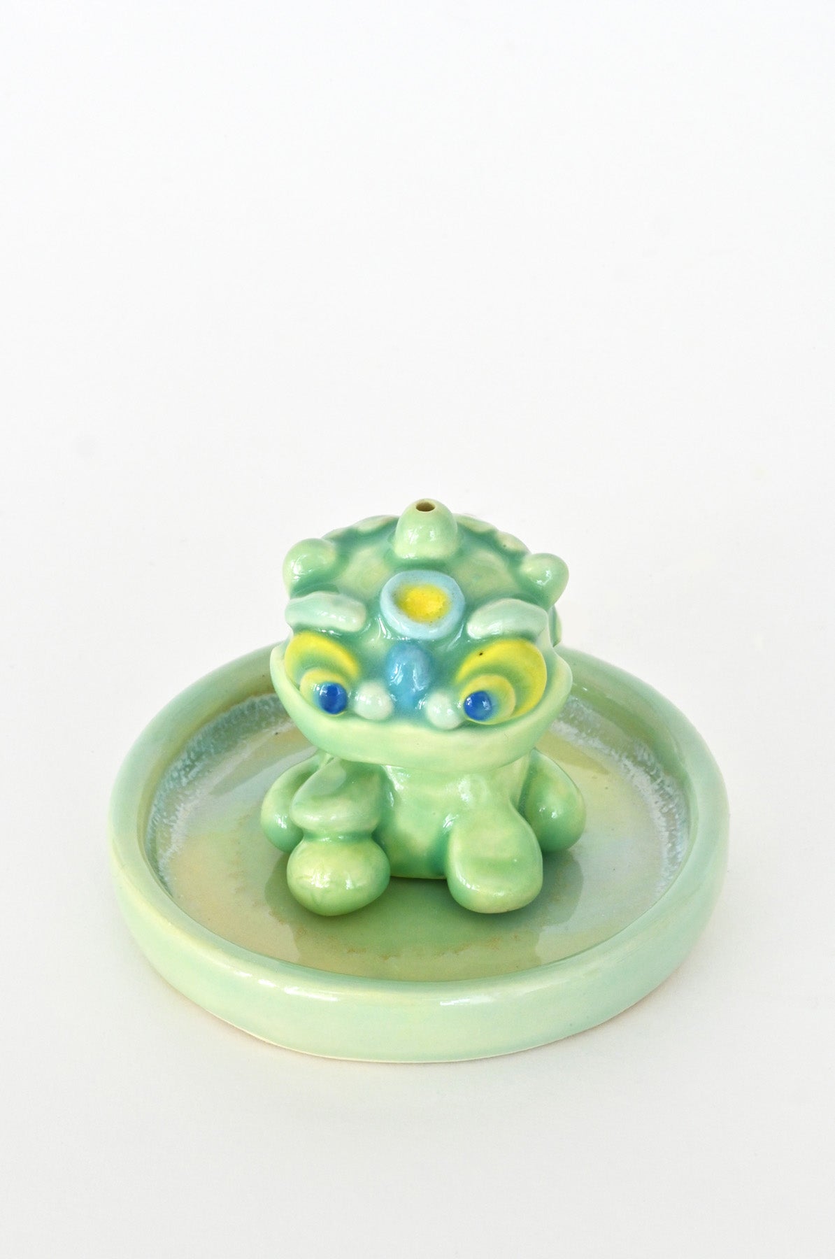 Male Lucky Lion holder close up by Caf Caf Ceramique at Abacus Row