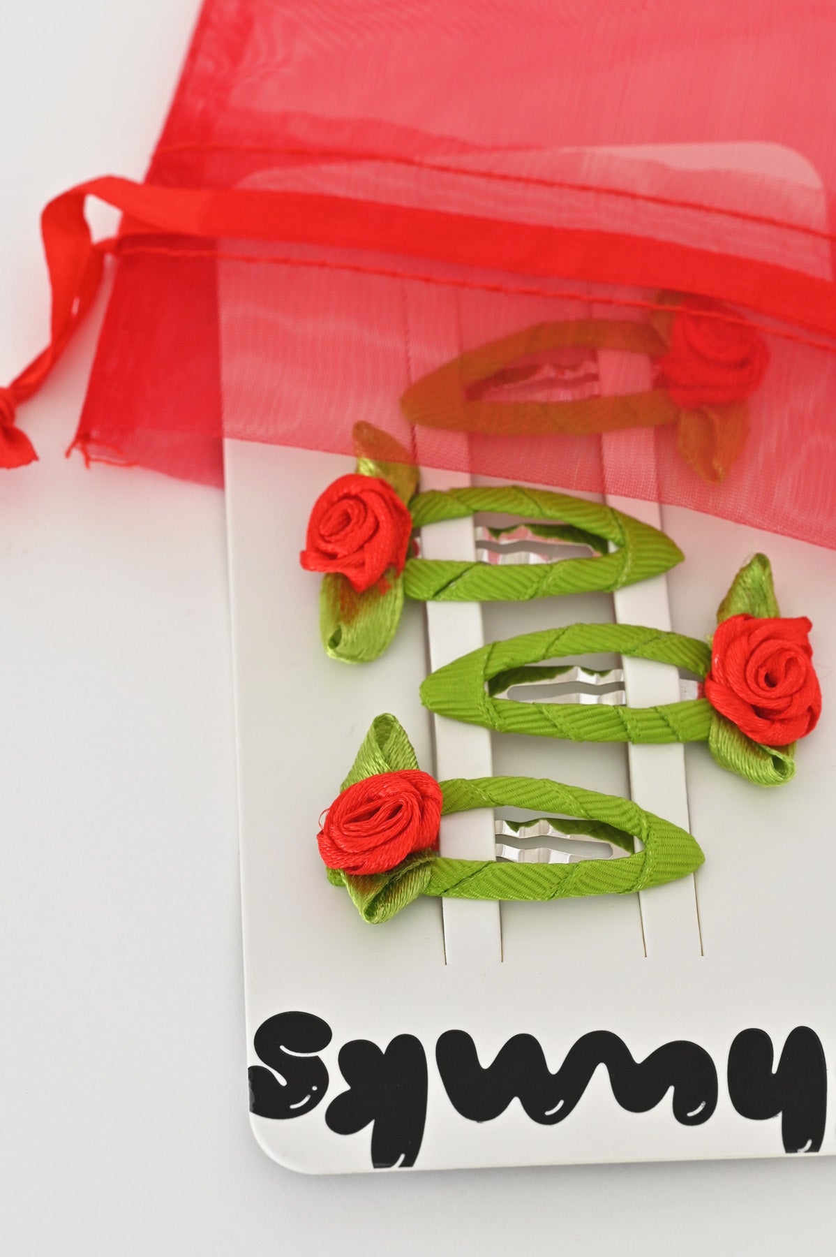 Bagged Red Rosette Snap Clips by Chunks at Abacus Row Jewelry