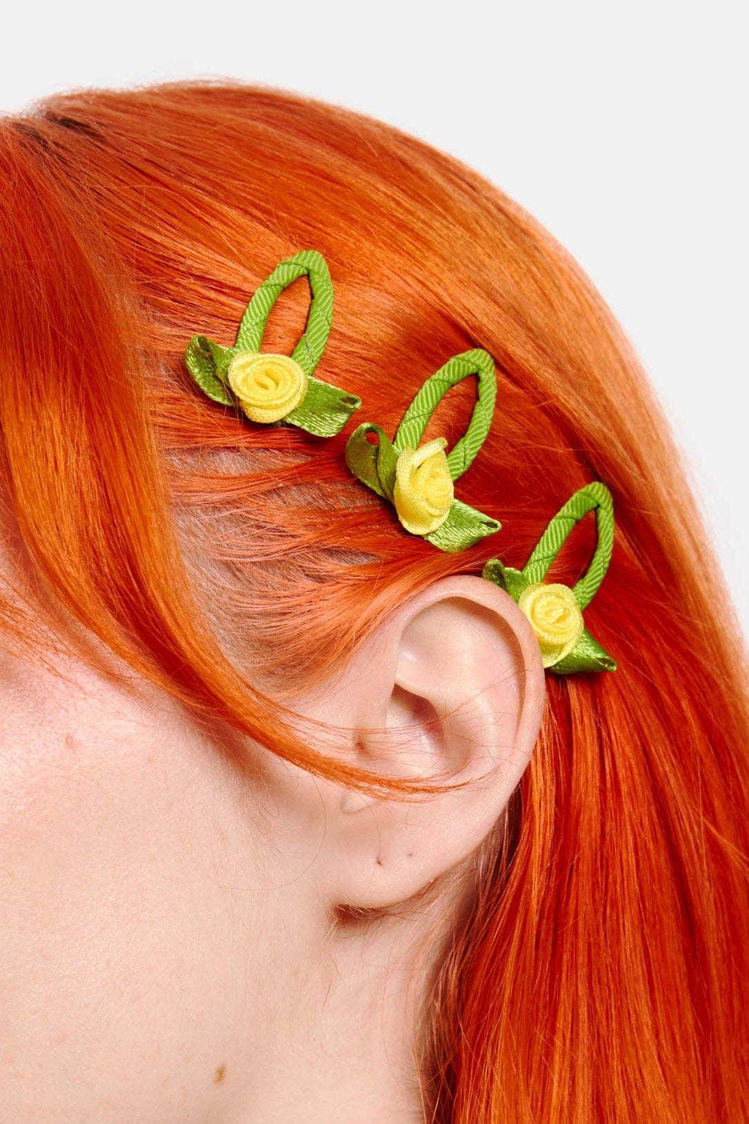 Yellow Rosette Snap Clips in hair close up by Chunks at Abacus Row Jewelry