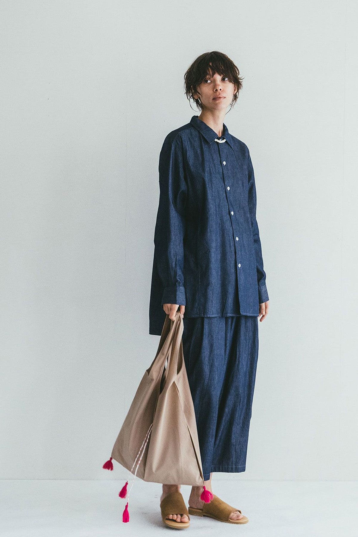 Holding Light Beige Amori Bag by Fog Linen at Abacus Row