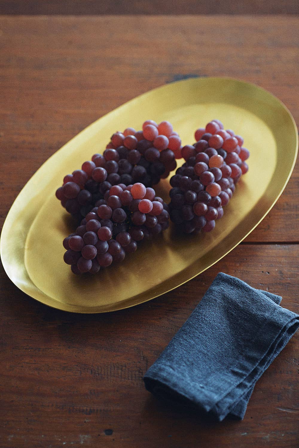 Styled with grapes Medium Brass Oval Tray by Fog Linen at Abacus Row