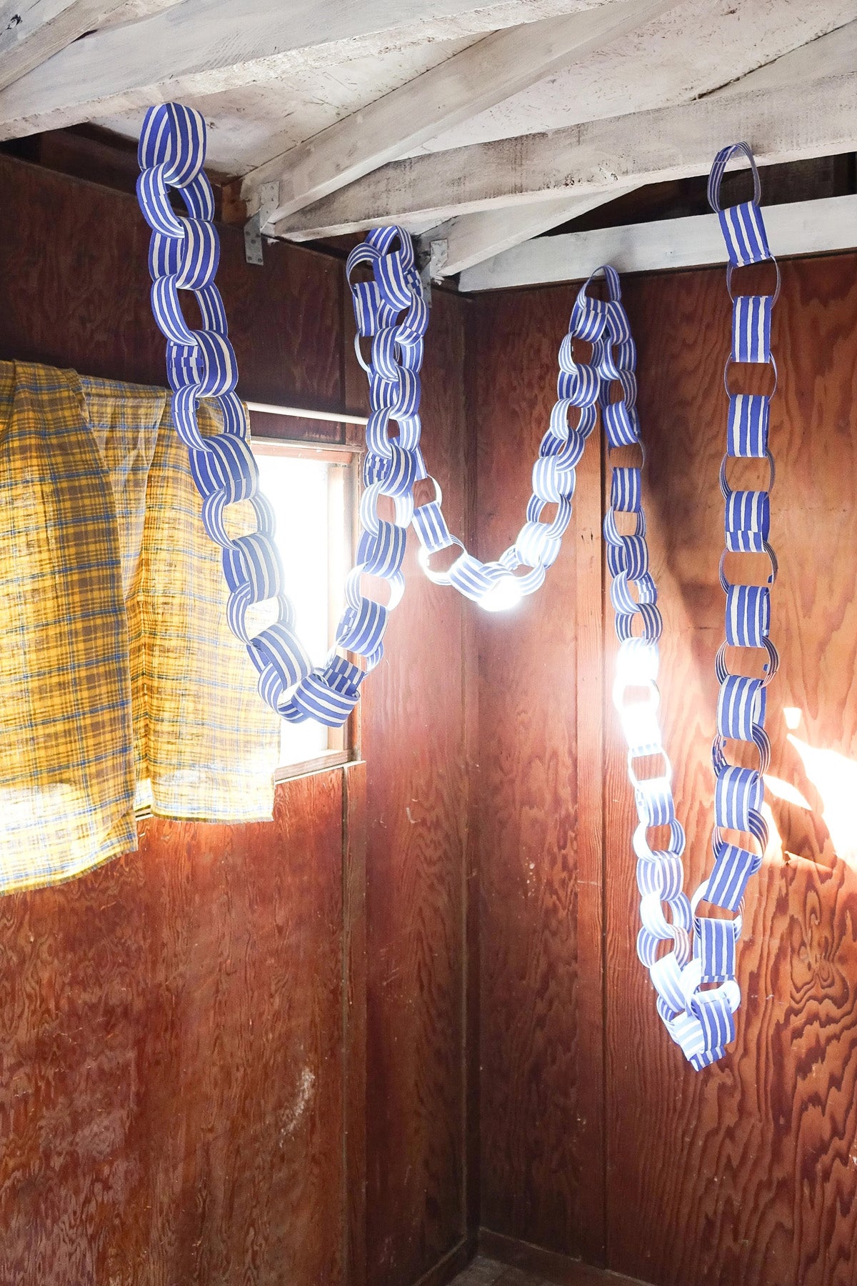 Blue Paper Chain Garland by Hataguchi Collective out in the world at Abacus Row