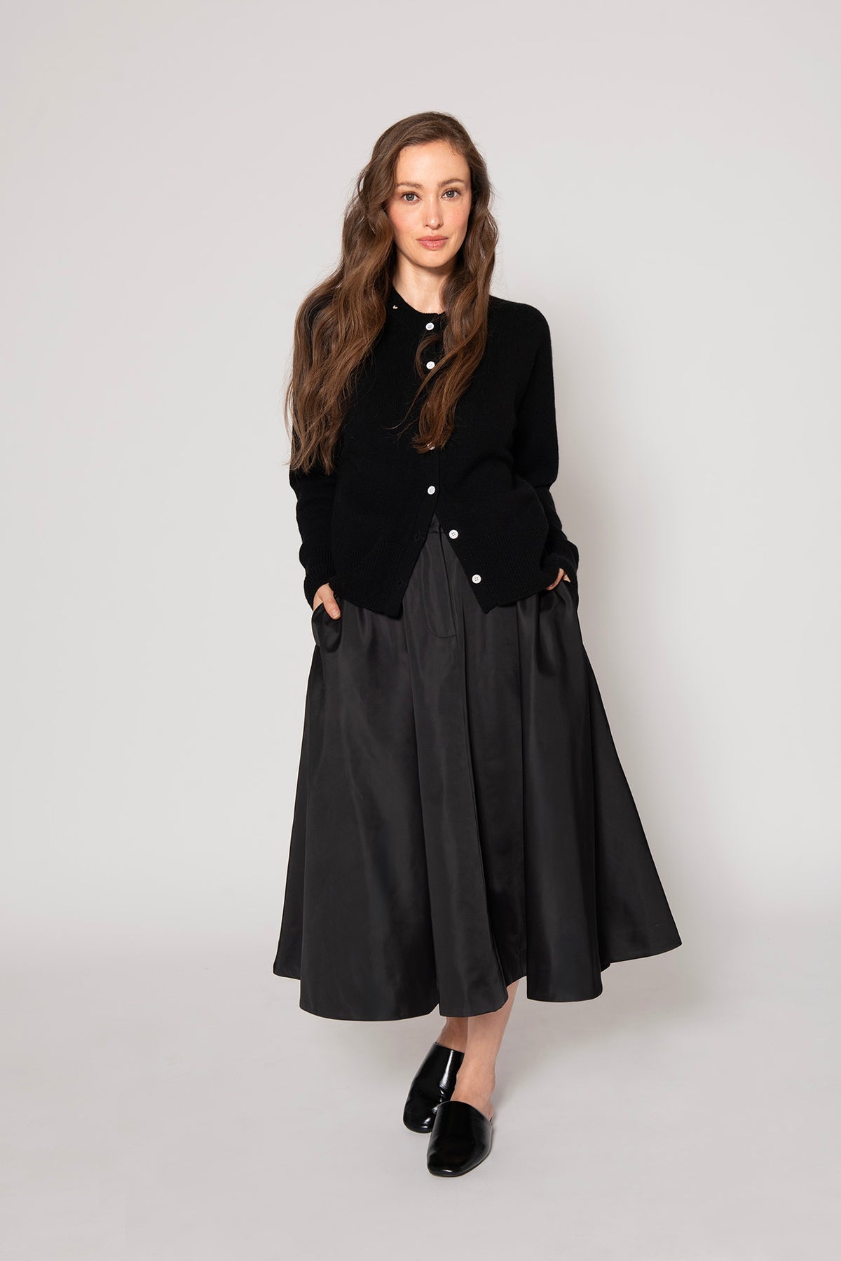Modeled Black Button Cardigan by Lao Lao at Abacus Row