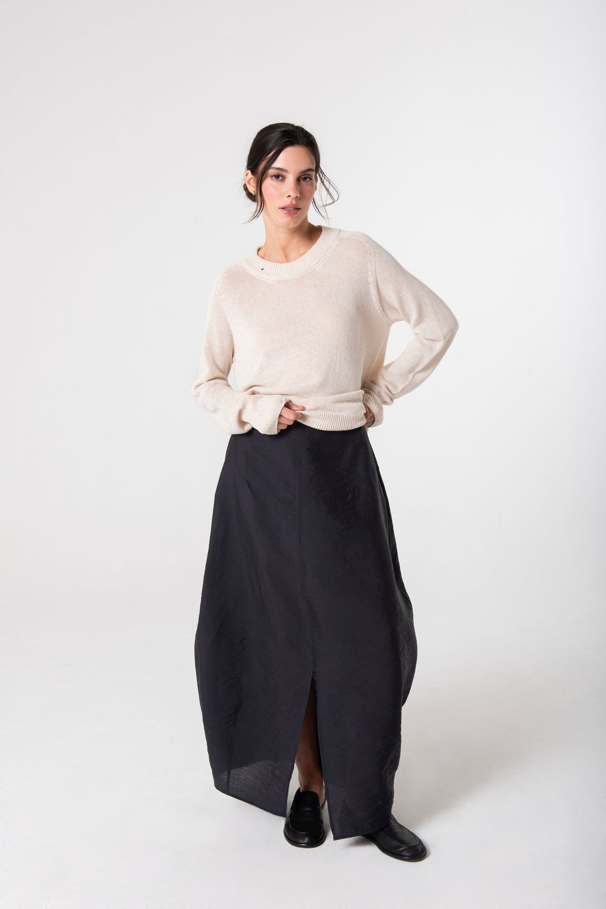 Styled Front of the Cream Chloe Linen Tee by Lao Lao at Abacus Row Handmade Jewelry