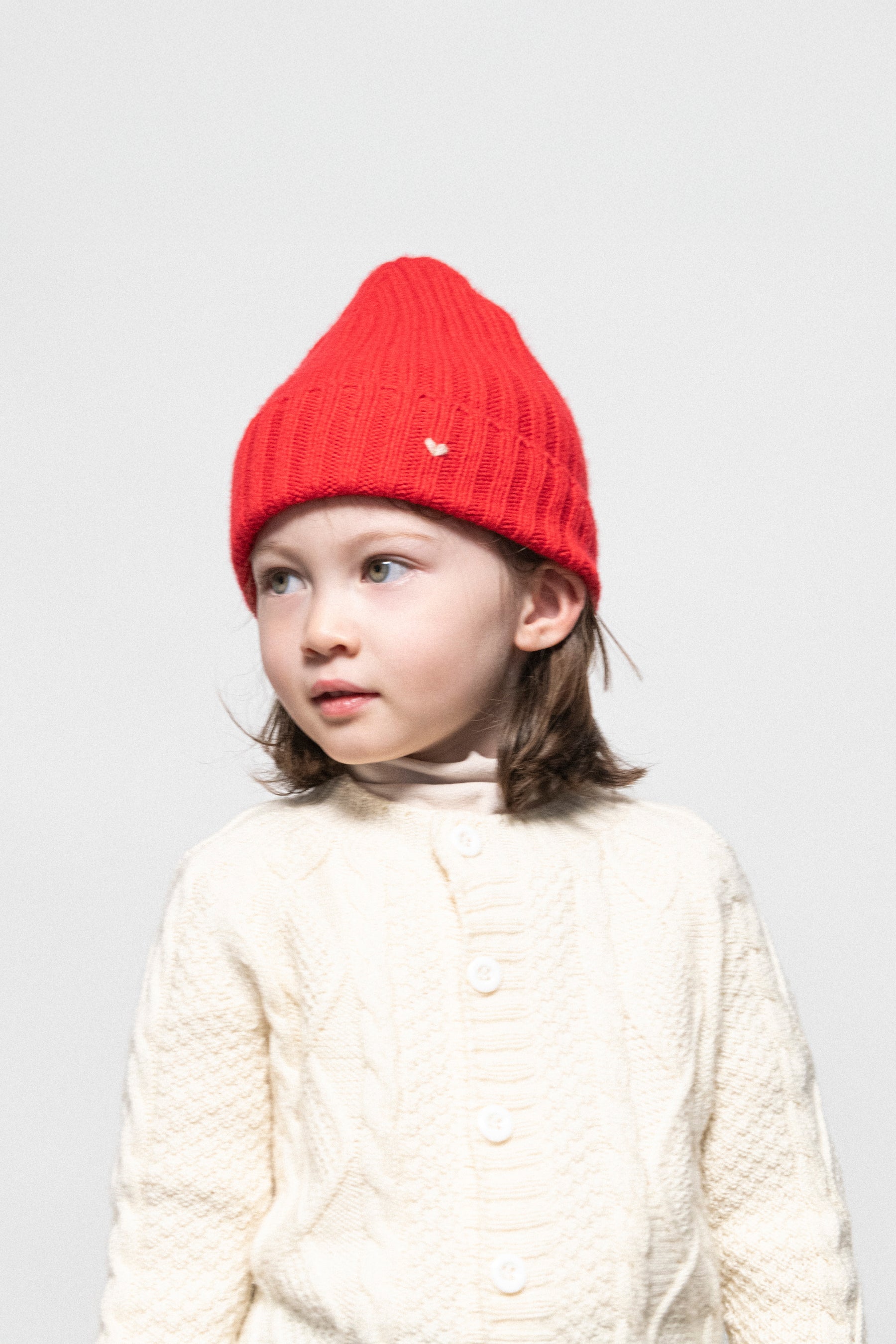 Modeled of Scarlet Red Rib Kids Beanie by Lao Lao at Abacus Row Handmade Jewelry