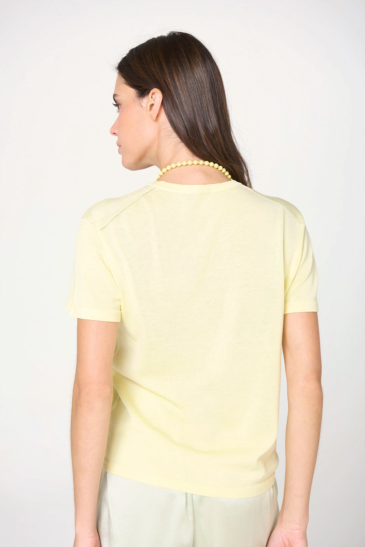 Back of the Styled Butter Yellow Silk Tee by Lao Lao at Abacus Row Handmade Jewelry