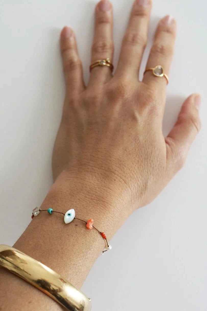 Evil Eye Charm Bracelet Modeled by See Real Flowers at Abacus Row Jewelry