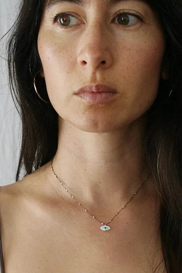 Modeled Evil Eye Necklace by See Real Flowers at Abacus Row Jewelry