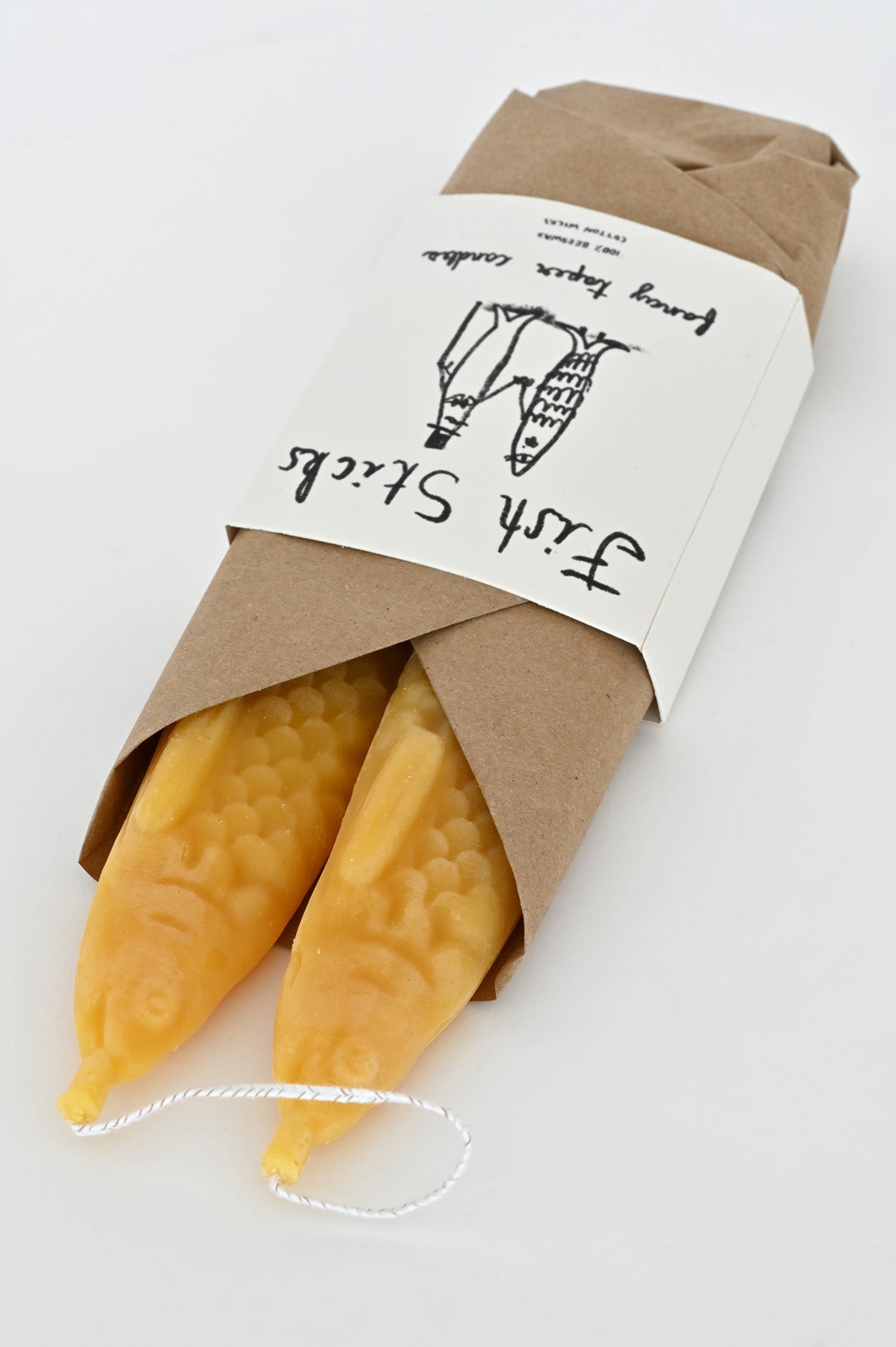 Fish Stick Candles in wrapping by Tinned Candle at Abacus Row